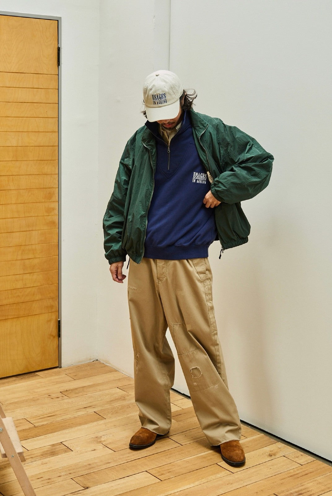 USAGE Lightweight Nylon Zip Up Jacket in Green - On Male Model