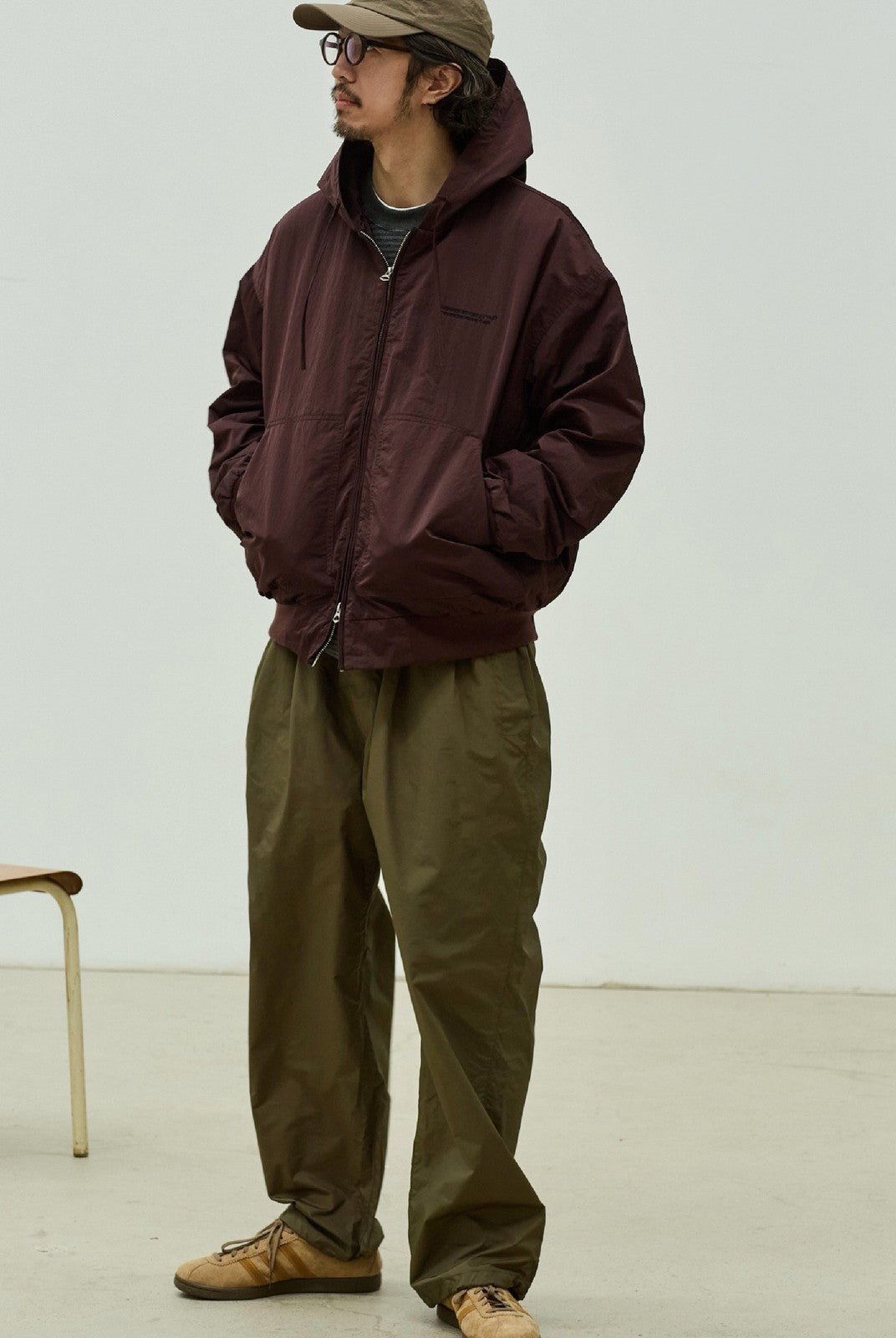 USAGE Crinkle Nylon Hooded Track Jacket in Brown - On Male Model