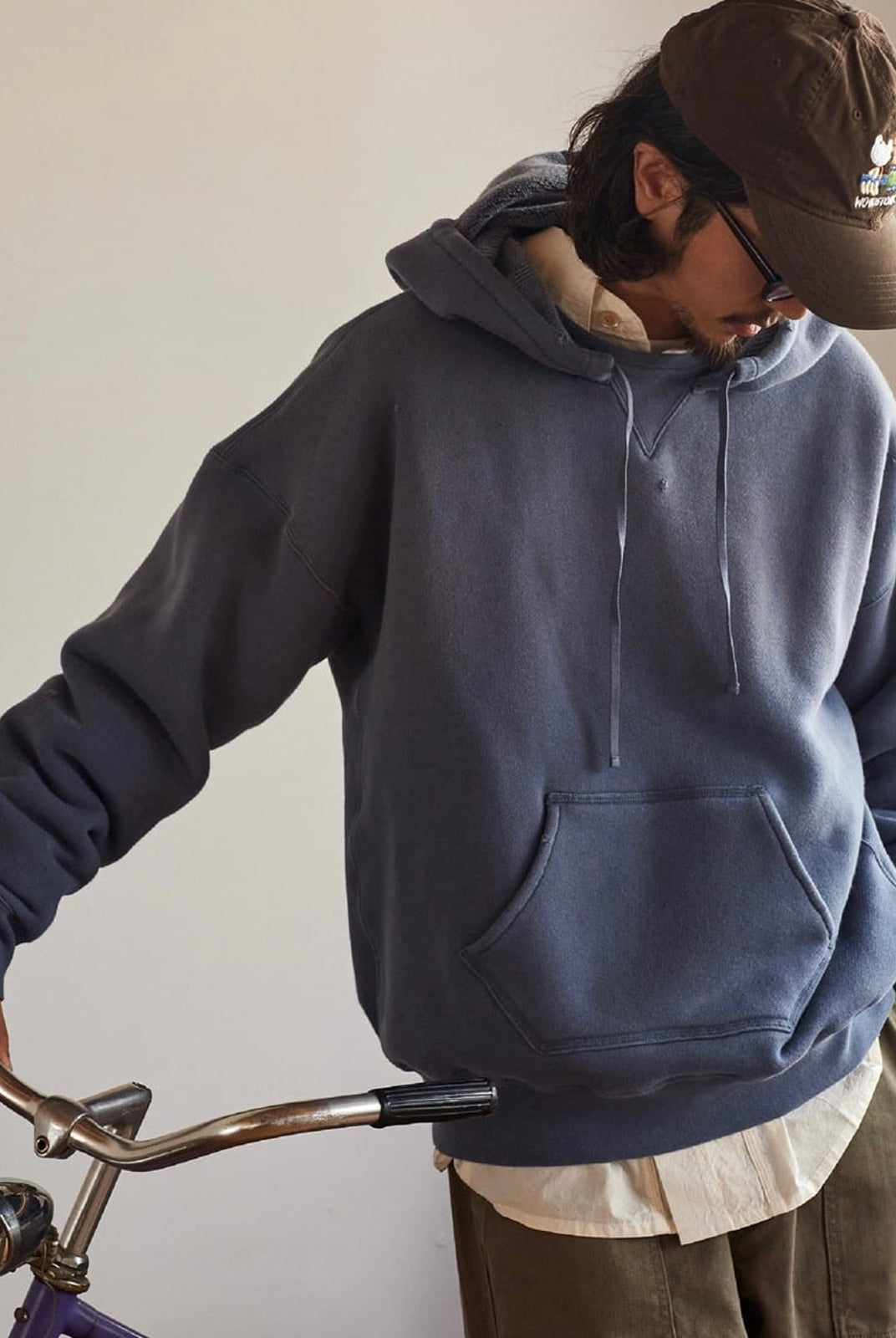 USAGE Faded Vintage Wash Hoodie in Blue - On Male Model