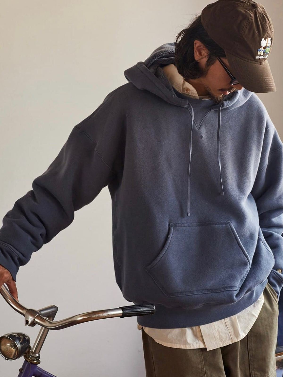USAGE Faded Vintage Wash Hoodie in Blue - On Male Model