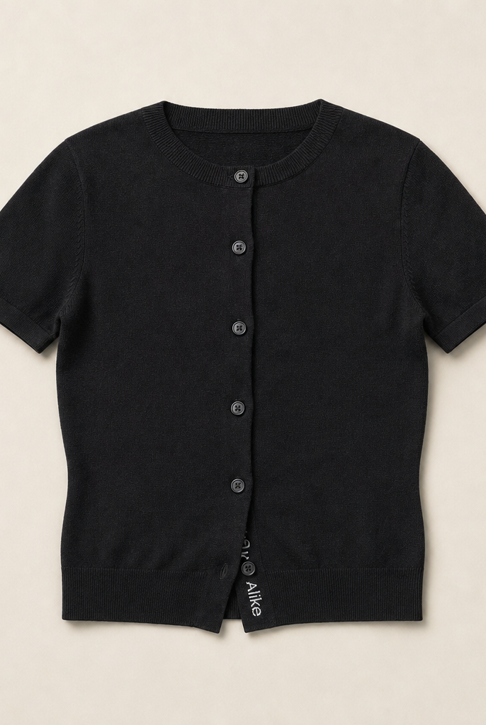 Mingstreet ASC launch still-life | RARELY ALIKE | Pure Wool Short Sleeve Cardigan | Black | generated_missing_still_life_expansion
