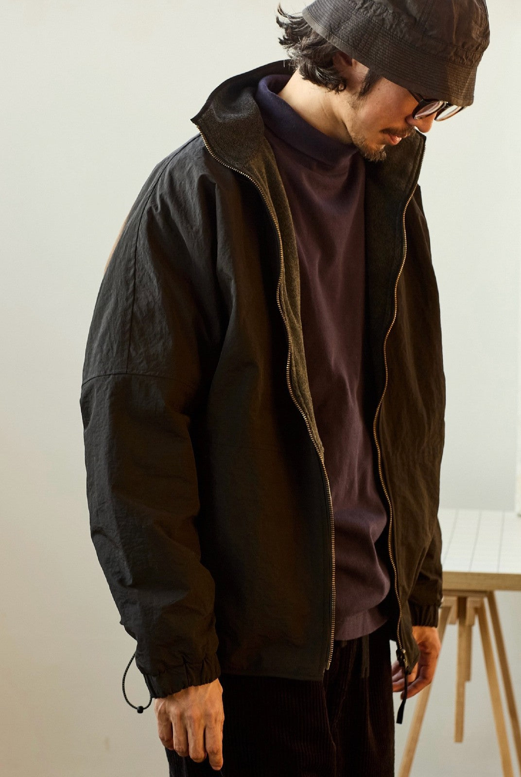 USAGE Reversible Nylon Fleece Track Jacket in Black - On Male Model
