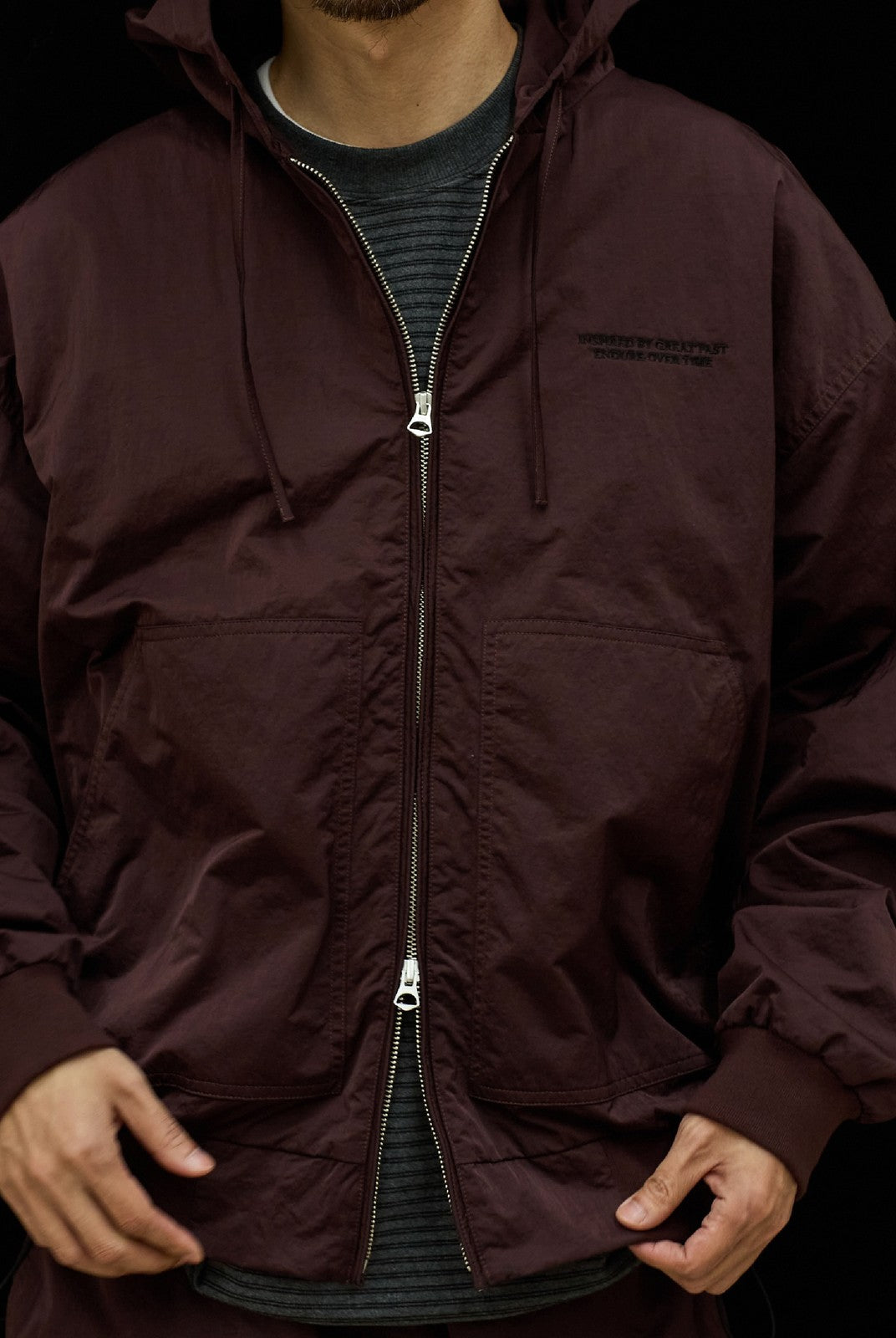 USAGE Crinkle Nylon Hooded Track Jacket in Brown - On Male Model