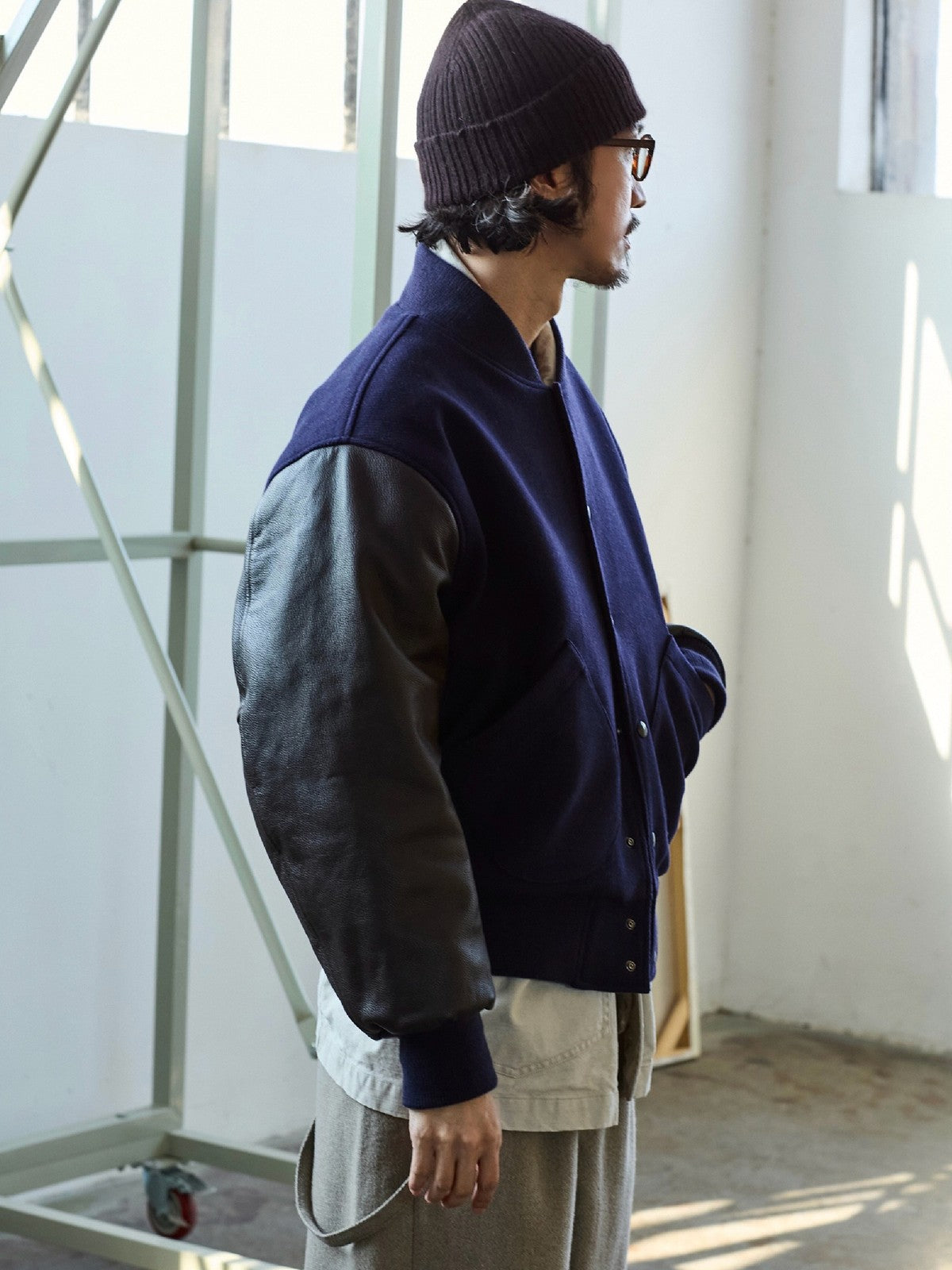 USAGE Reversible Velvet Leather Varsity Jacket in Navy Blue - On Male Model