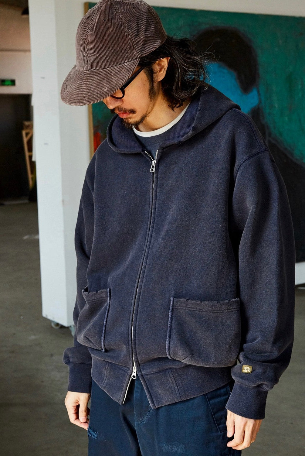 USAGE Hand Distressed Washed Zip Hoodie in Navy Blue - On Male Model