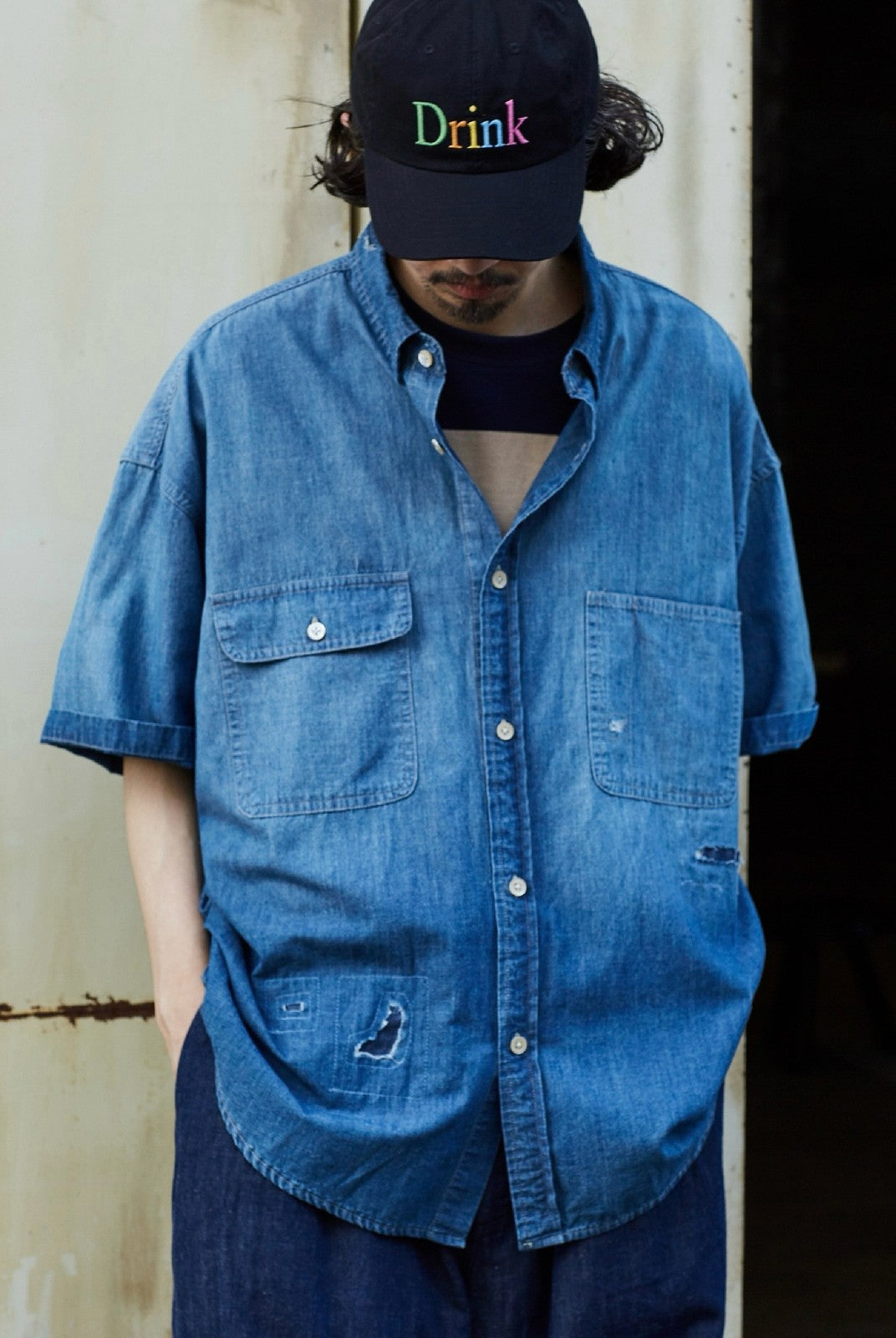 USAGE Distressed Short Sleeve Denim Shirt in Denim - On Male Model