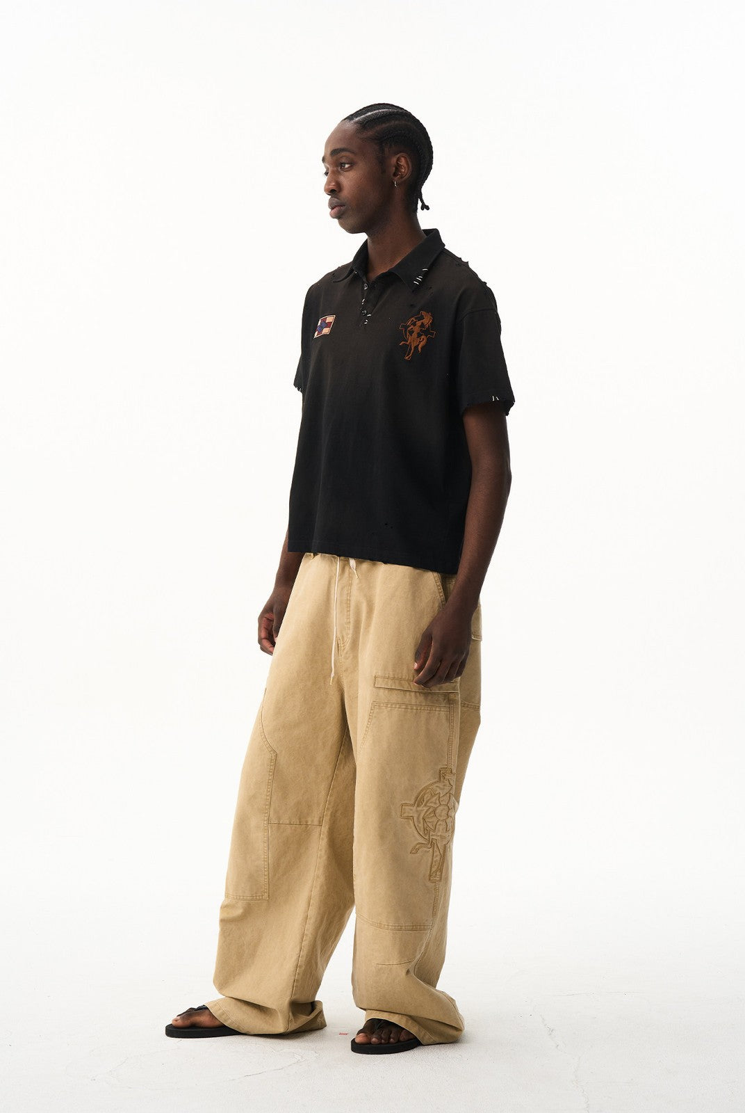 BLINDNOPLAN Distressed Embroidered Cotton Polo in Black - On Male Model