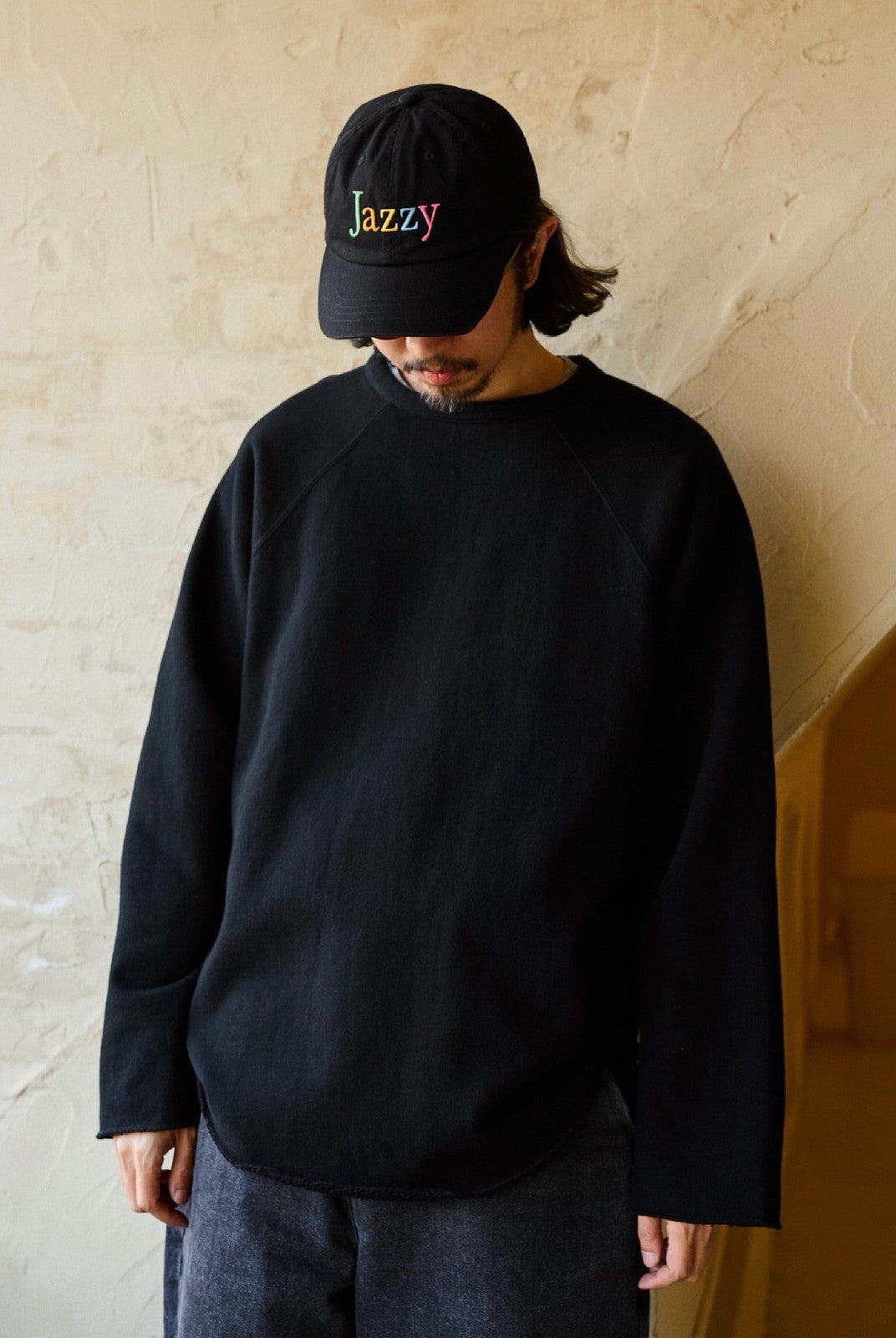 USAGE Slub Cotton Raglan Sweatshirt in Black - On Male Model