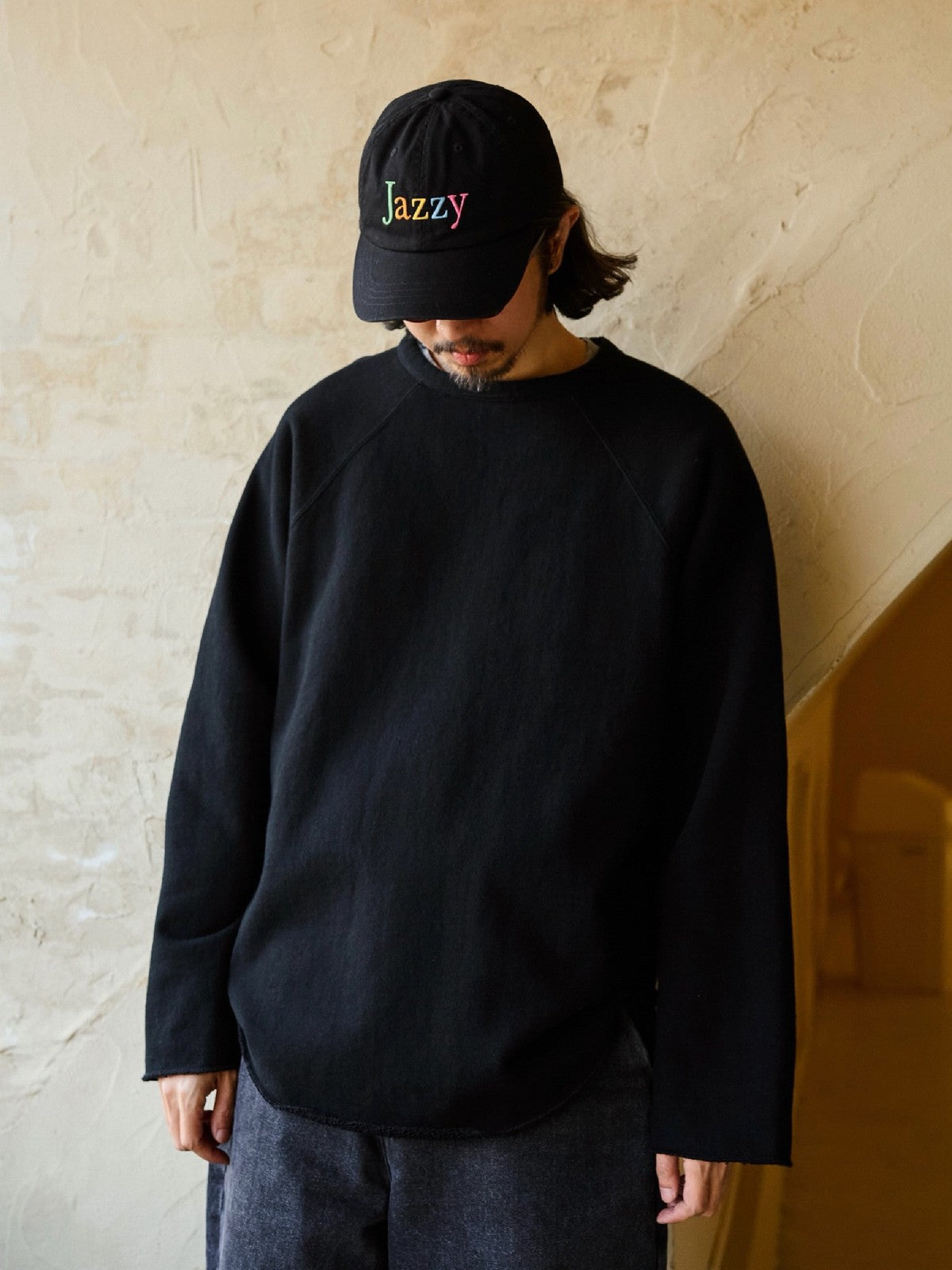 USAGE Slub Cotton Raglan Sweatshirt in Black - On Male Model