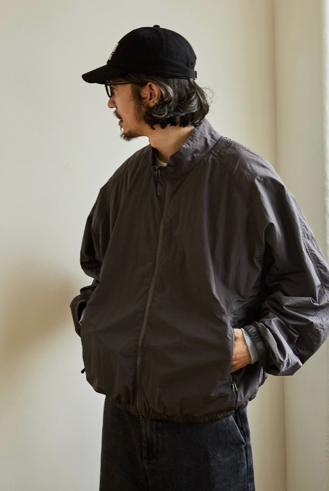 USAGE Lightweight Nylon Zip Up Jacket in Gray - On Male Model