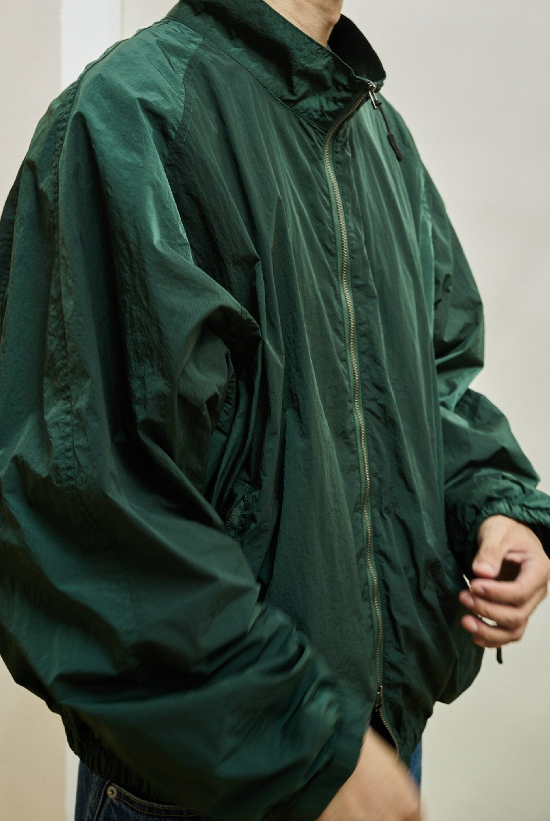 USAGE Lightweight Nylon Zip Up Jacket in Green - On Male Model