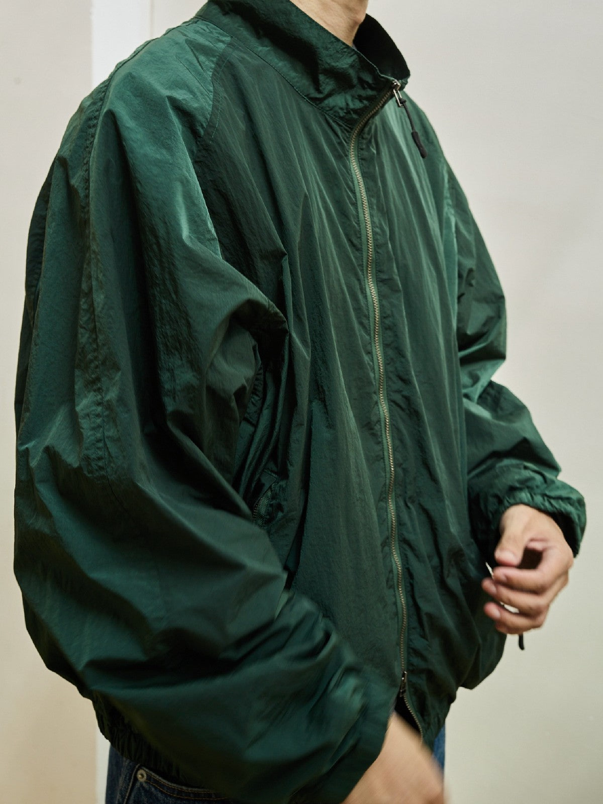 USAGE Lightweight Nylon Zip Up Jacket in Green - On Male Model