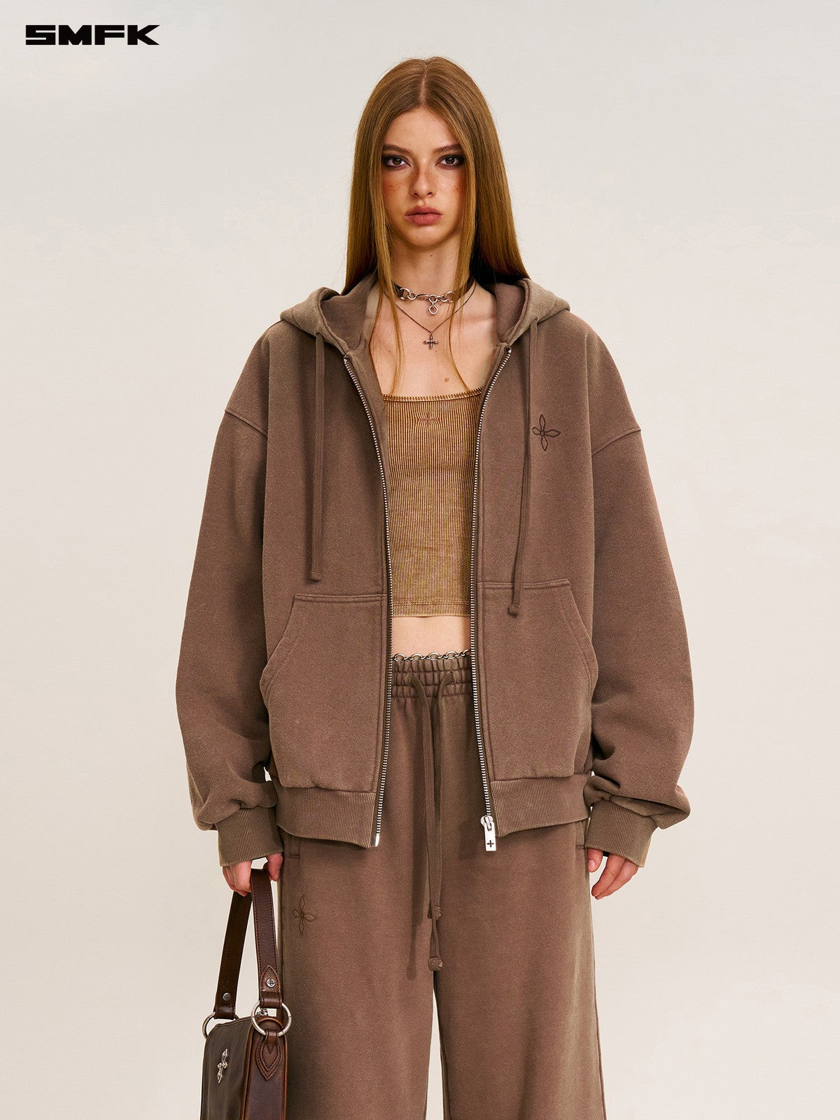 SMFK Cross Embroidered Cotton Zip Up Hoodie in Brown - On Female Model