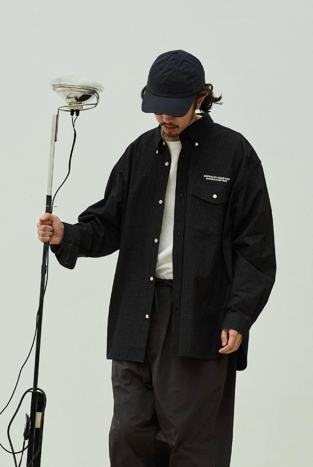 USAGE Oversized Micro Check Button Down Shirt in Black - On Male Model