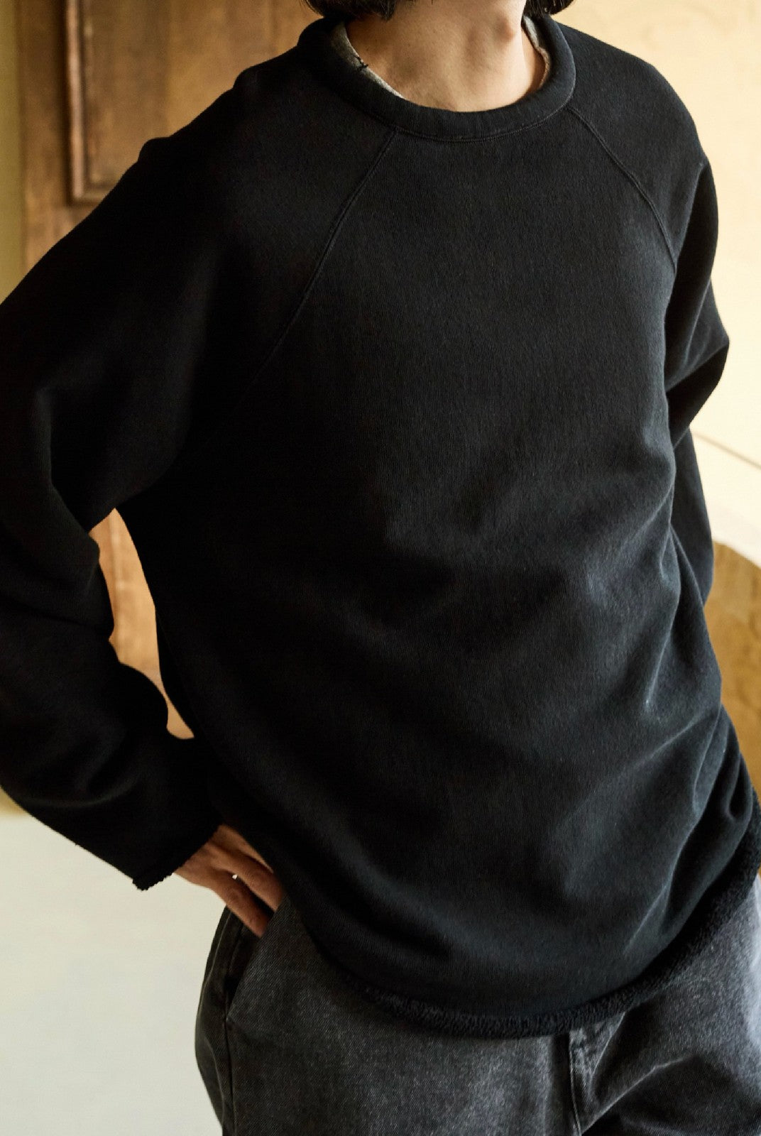 USAGE Slub Cotton Raglan Sweatshirt in Black - On Male Model