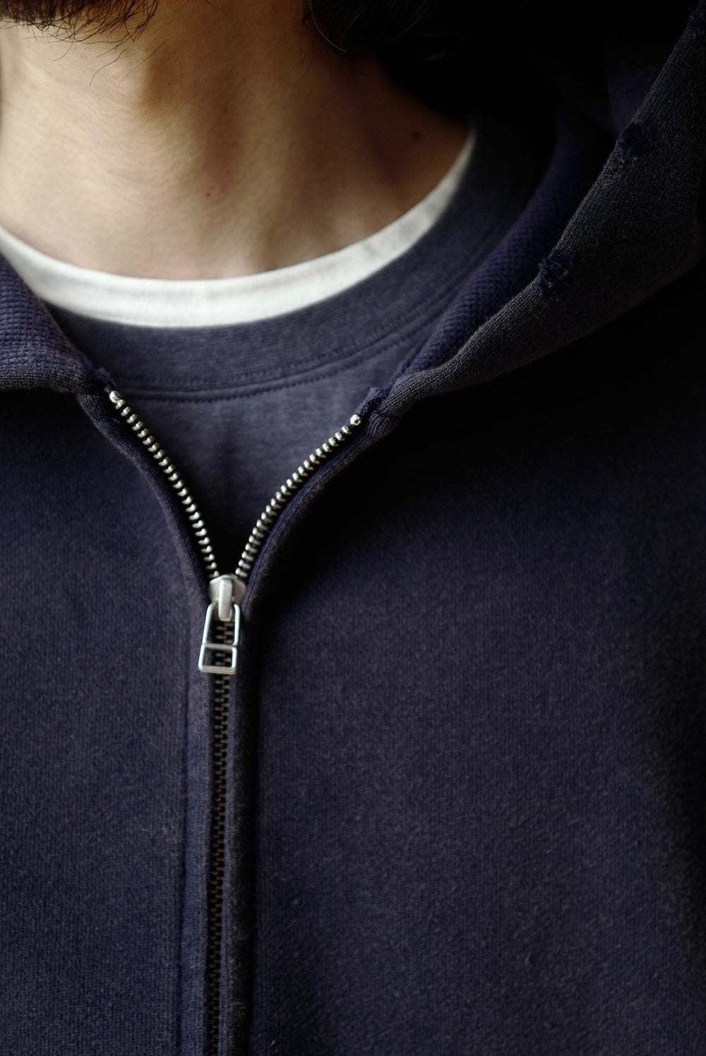 USAGE Hand Distressed Washed Zip Hoodie in Navy Blue - On Male Model