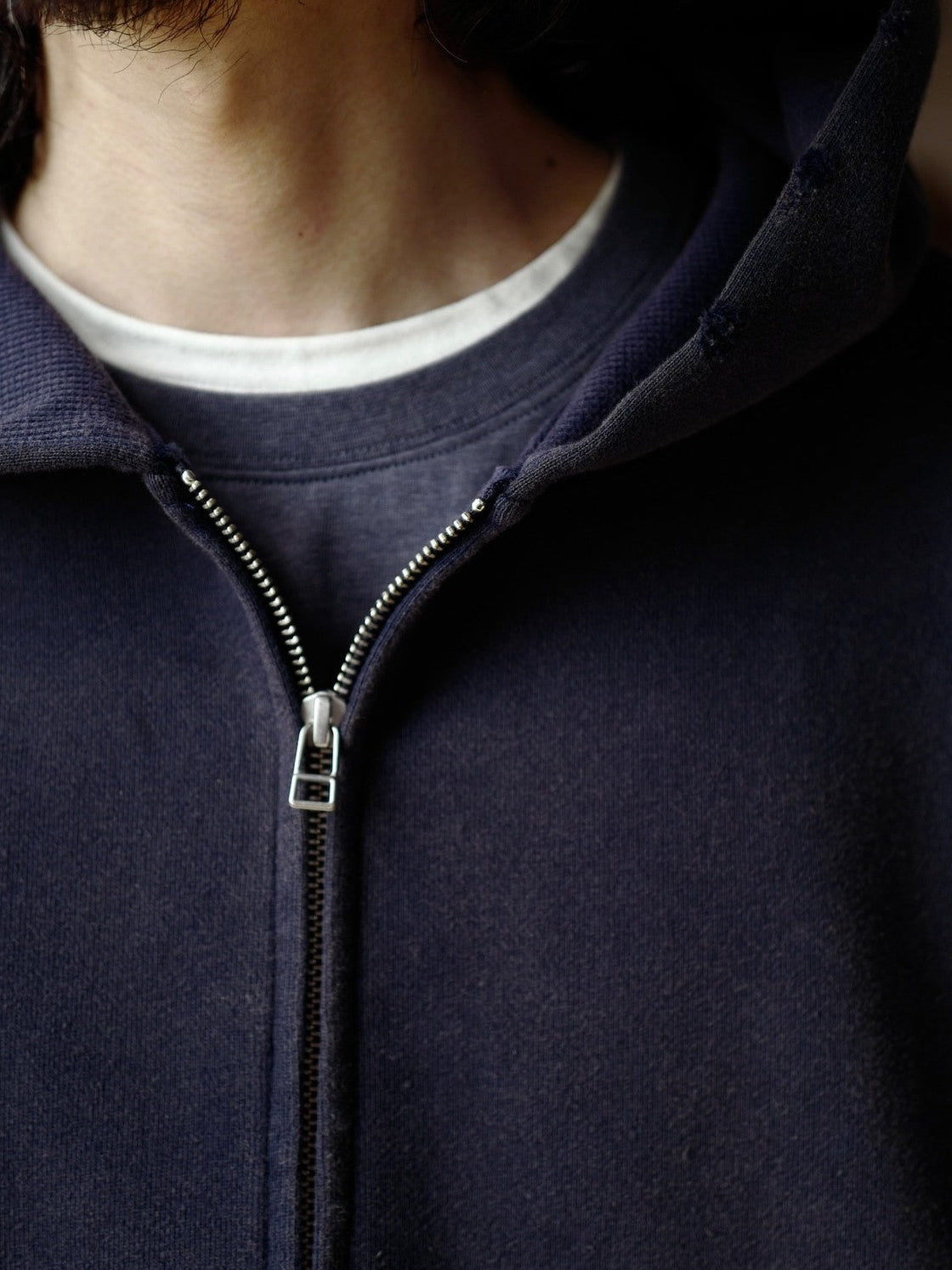 USAGE Hand Distressed Washed Zip Hoodie in Navy Blue - On Male Model