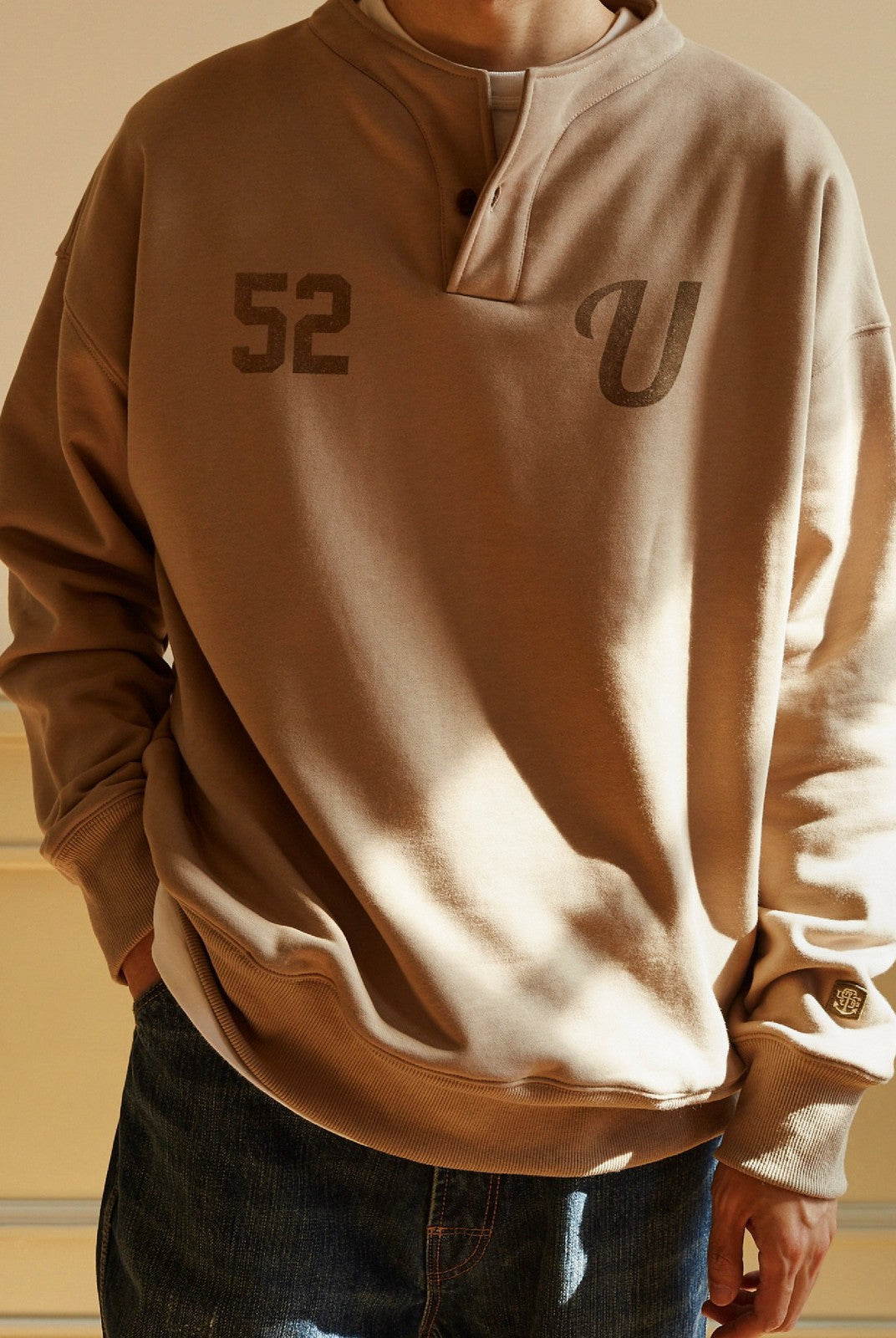 USAGE Terry Cotton Henley Sweatshirt in Beige - On Male Model