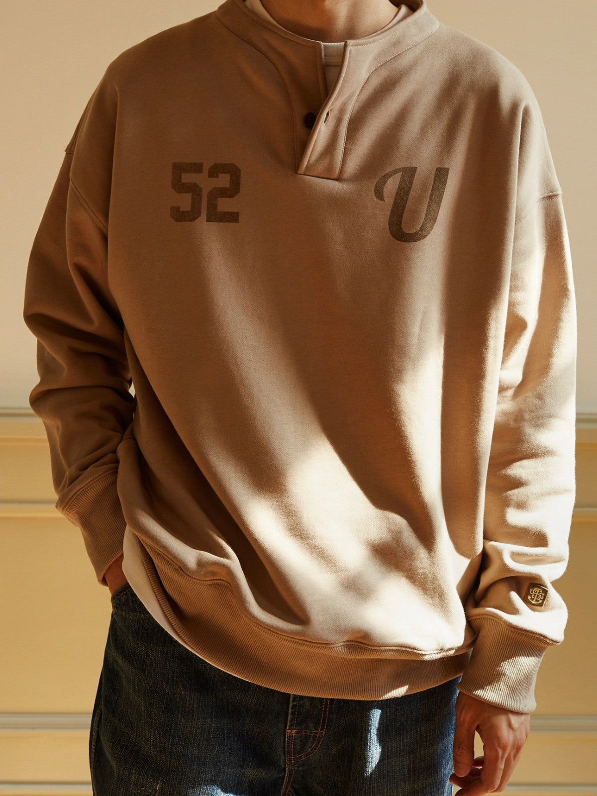 USAGE Terry Cotton Henley Sweatshirt in Beige - On Male Model