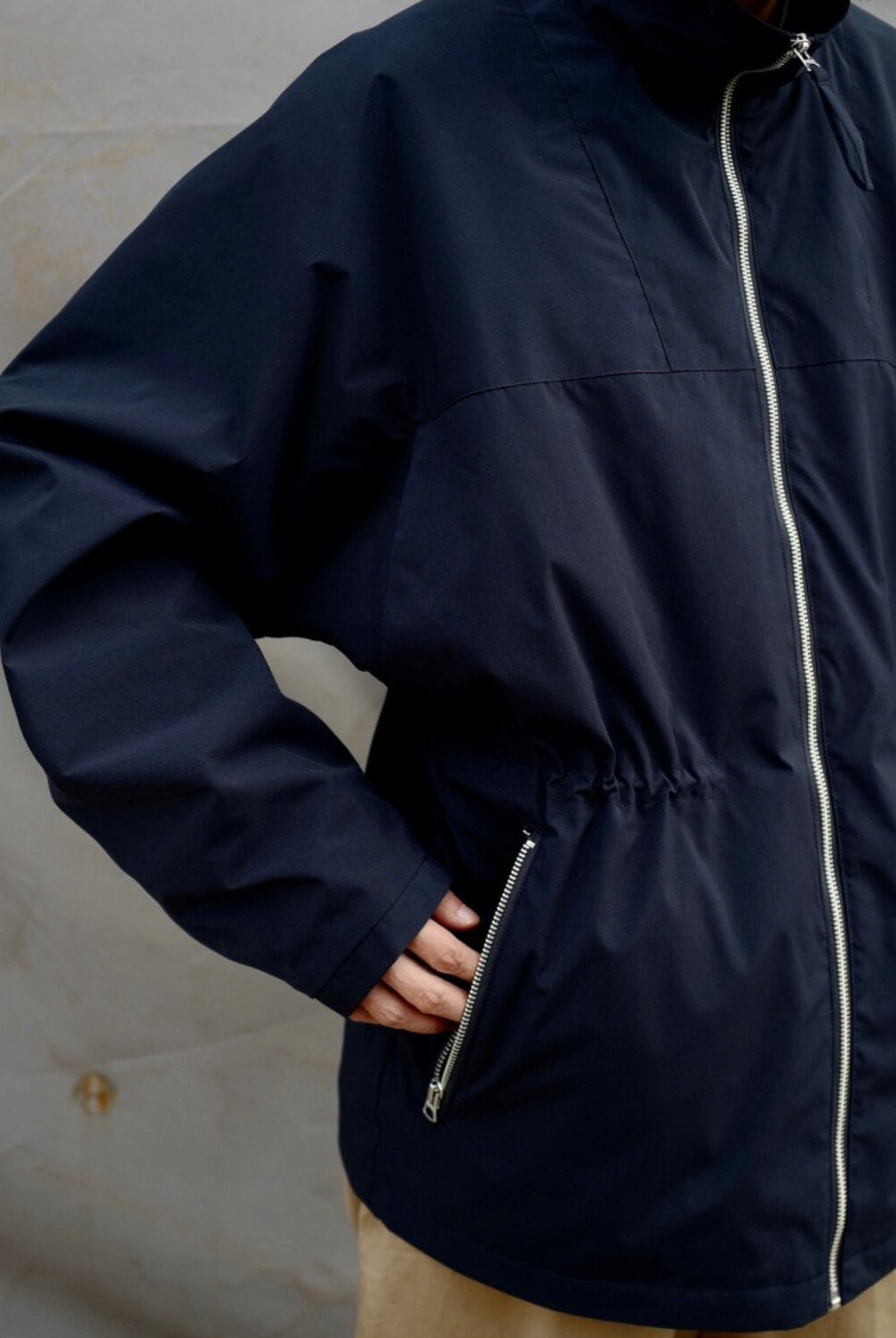 USAGE Drawstring Zip Front Tech Anorak in Navy Blue - On Male Model