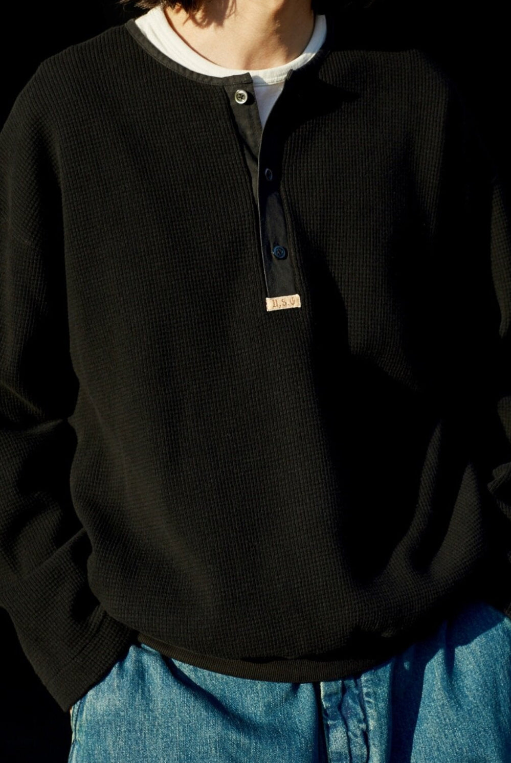 USAGE Heavyweight Waffle Knit Henley Sweatshirt in Black - On Male Model