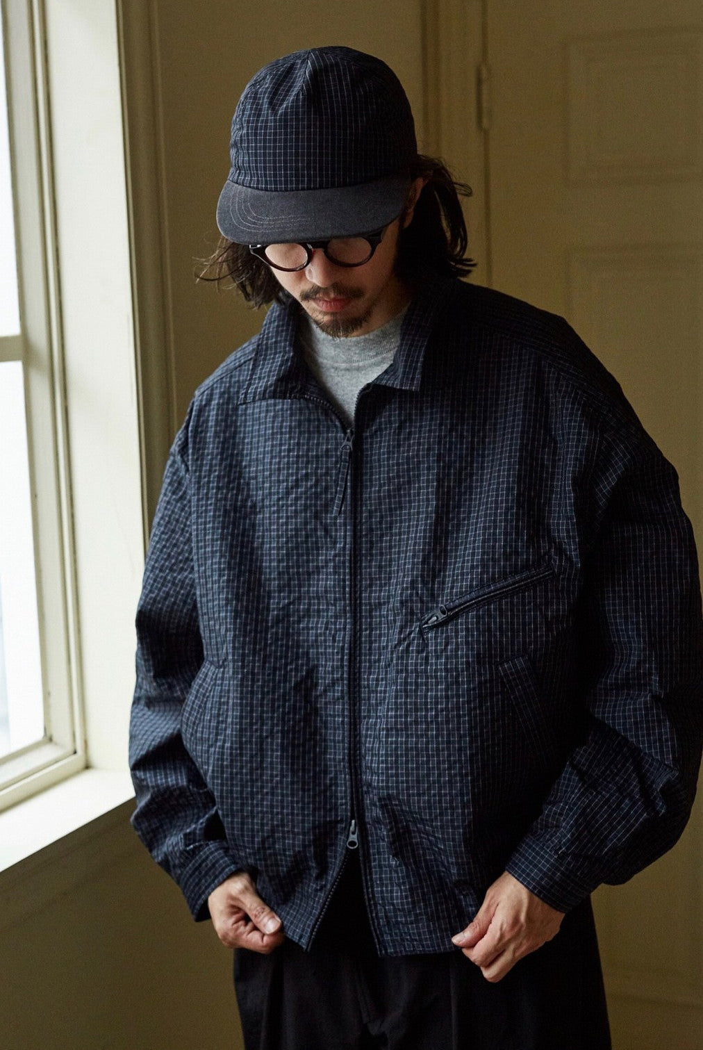 USAGE Jacquard Check Harrington Jacket in Navy Blue - On Male Model