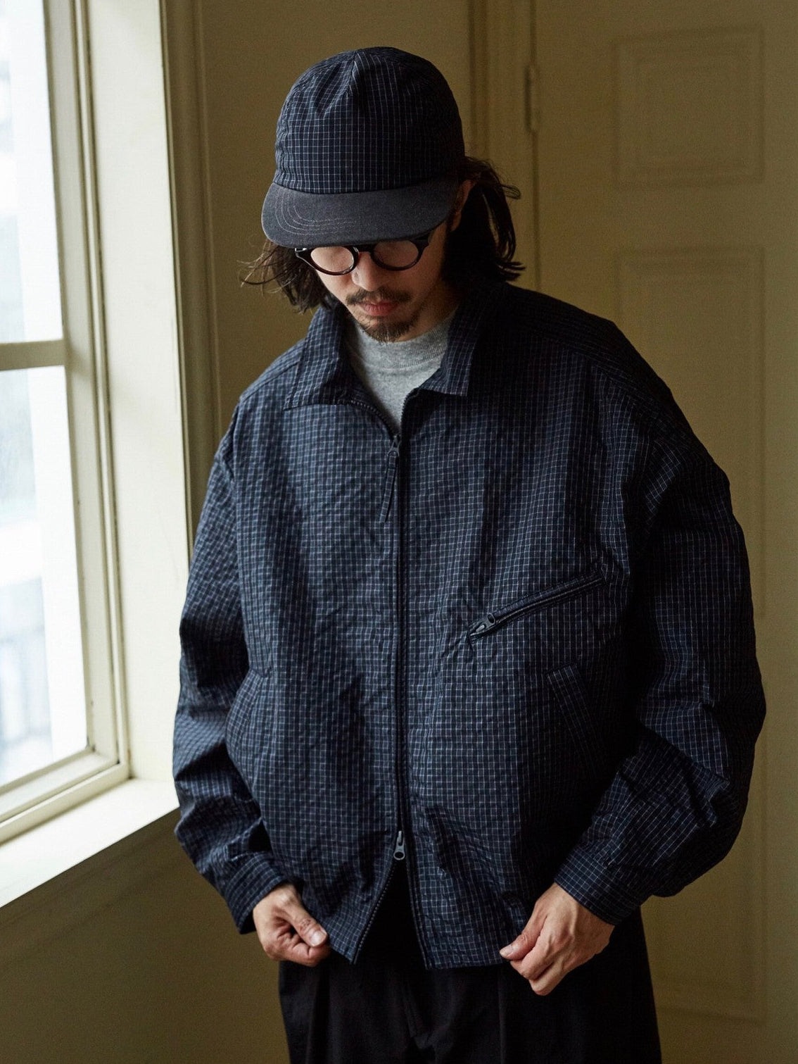 USAGE Jacquard Check Harrington Jacket in Navy Blue - On Male Model