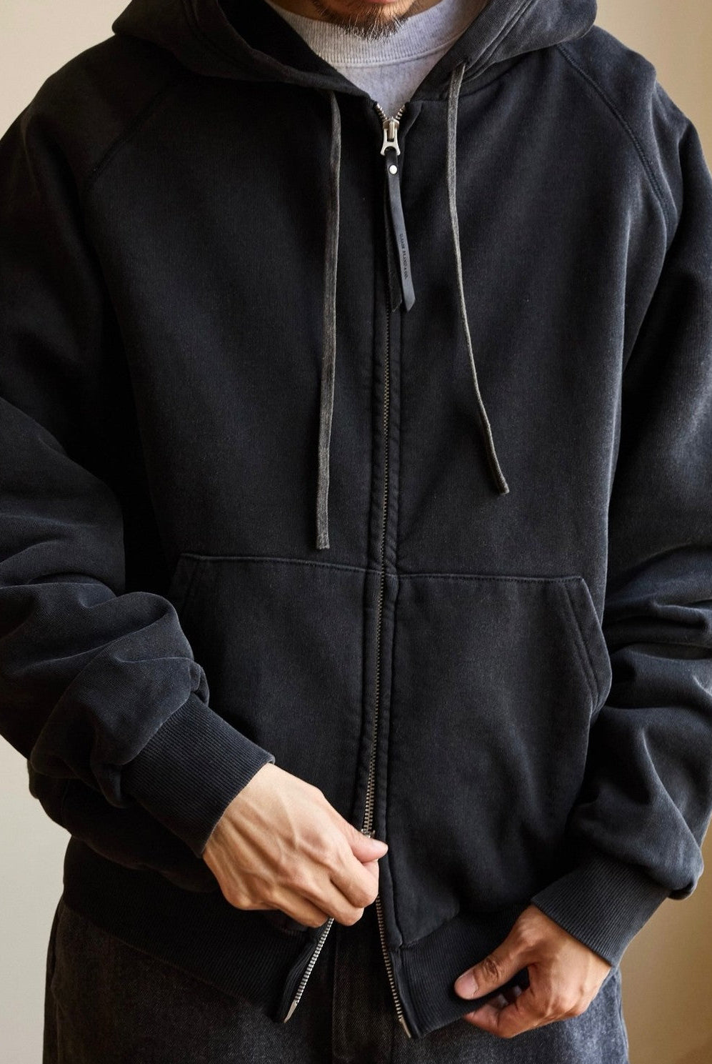 USAGE Vintage Washed Double Layer Zip Hoodie in Black - On Male Model