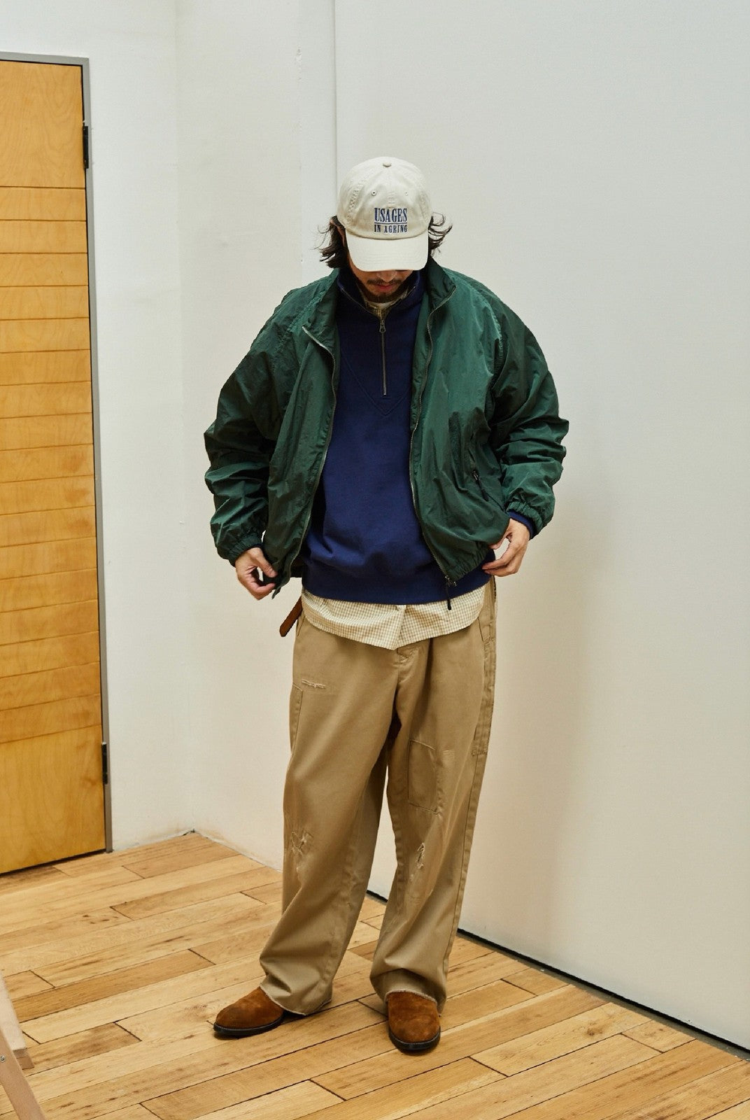 USAGE Lightweight Nylon Zip Up Jacket in Green - On Male Model