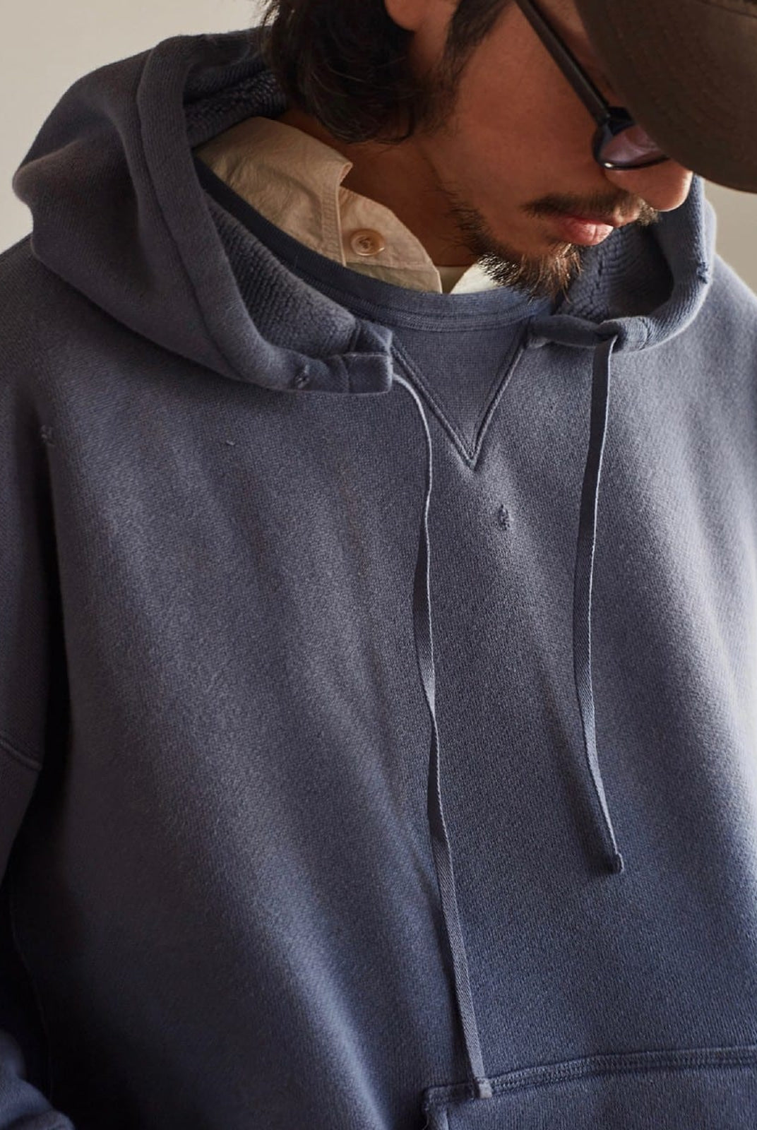 USAGE Faded Vintage Wash Hoodie in Blue - On Male Model