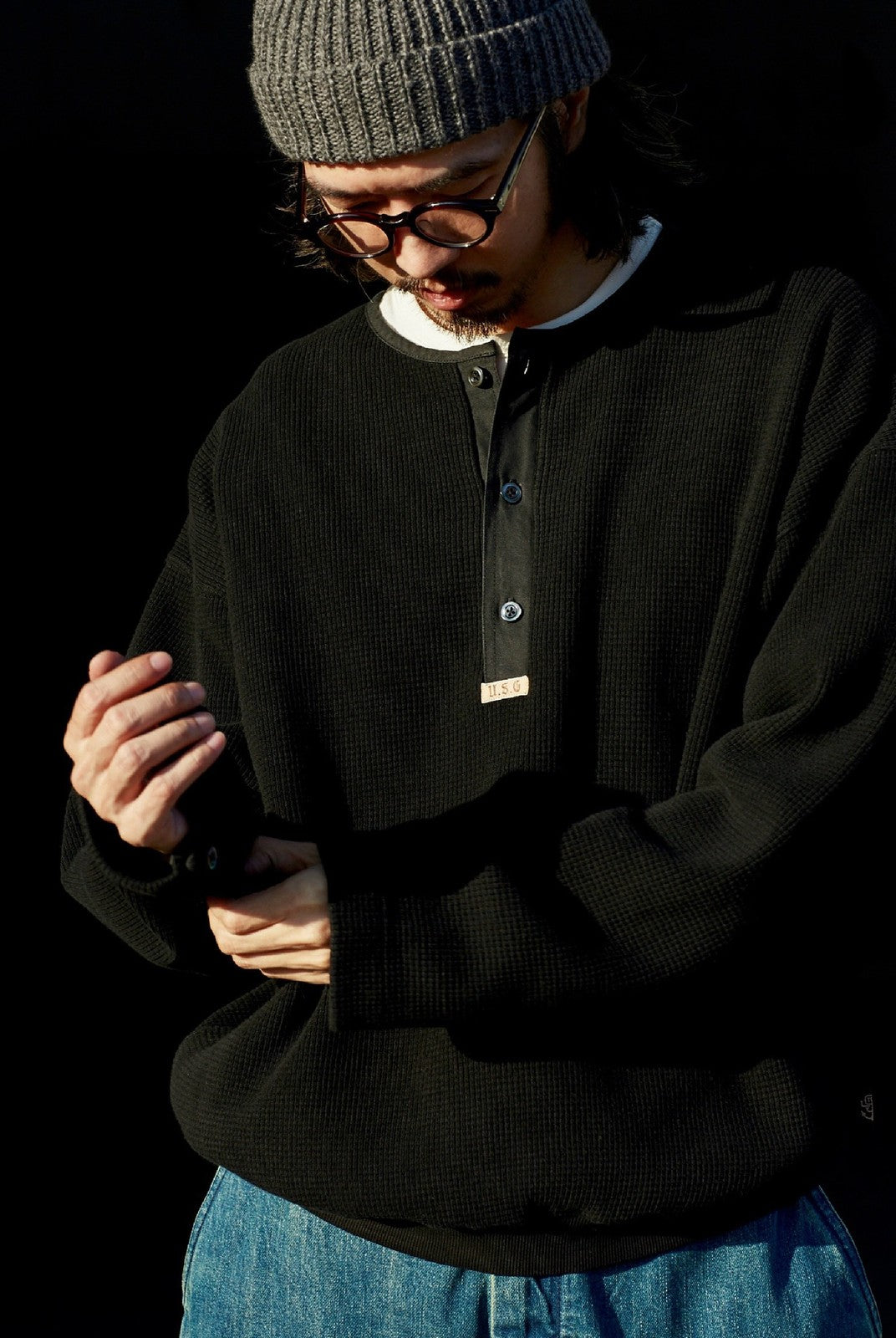 USAGE Heavyweight Waffle Knit Henley Sweatshirt in Black - On Male Model