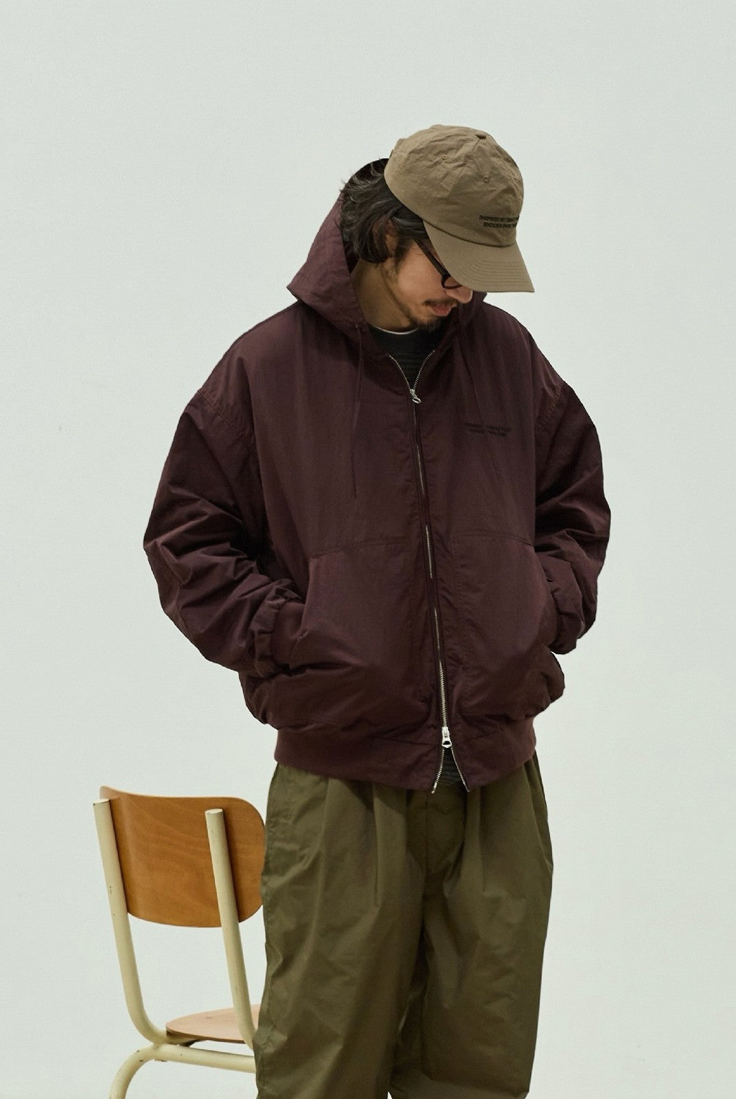 USAGE Crinkle Nylon Hooded Track Jacket in Brown - On Male Model