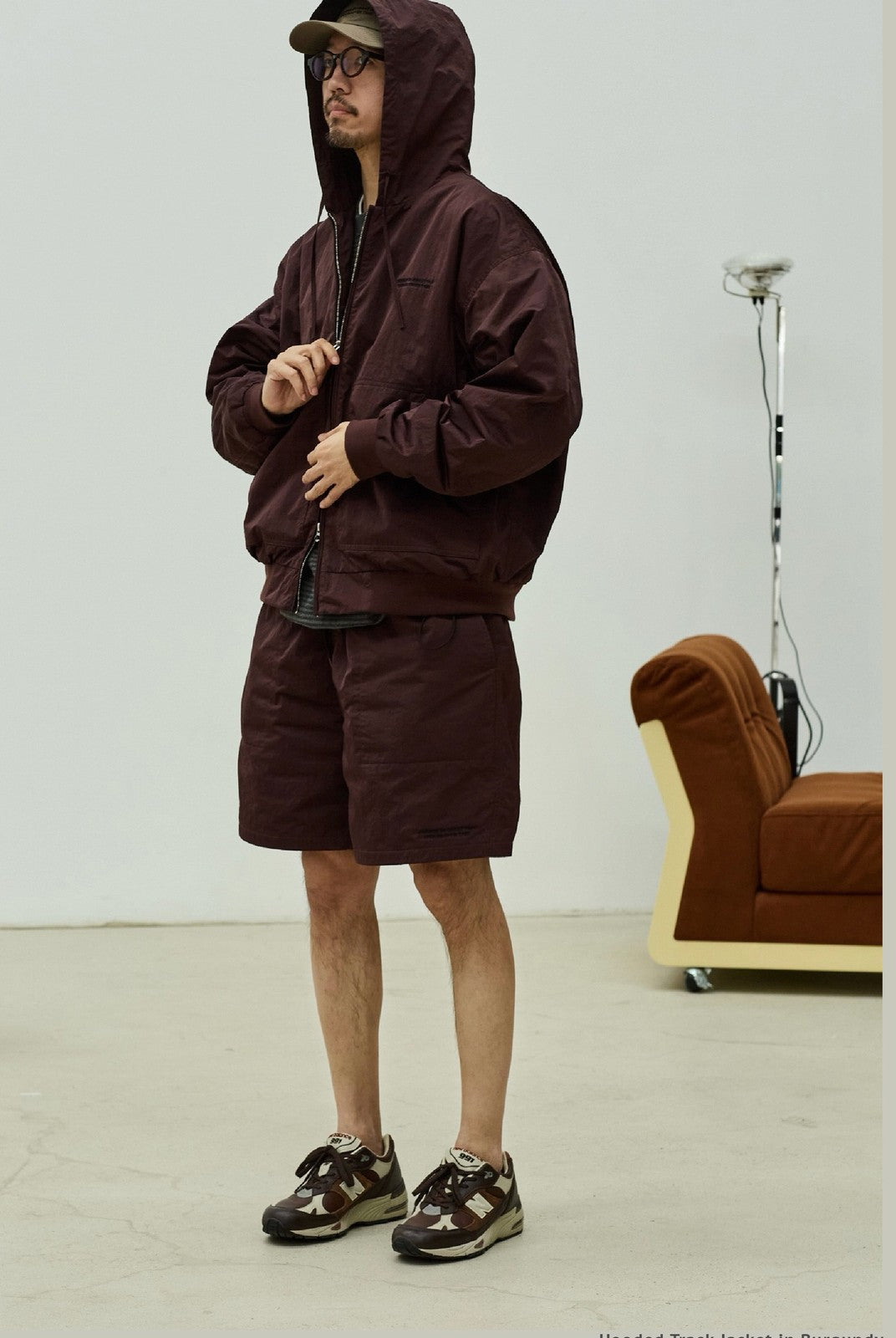 USAGE Crinkle Nylon Hooded Track Jacket in Brown - On Male Model