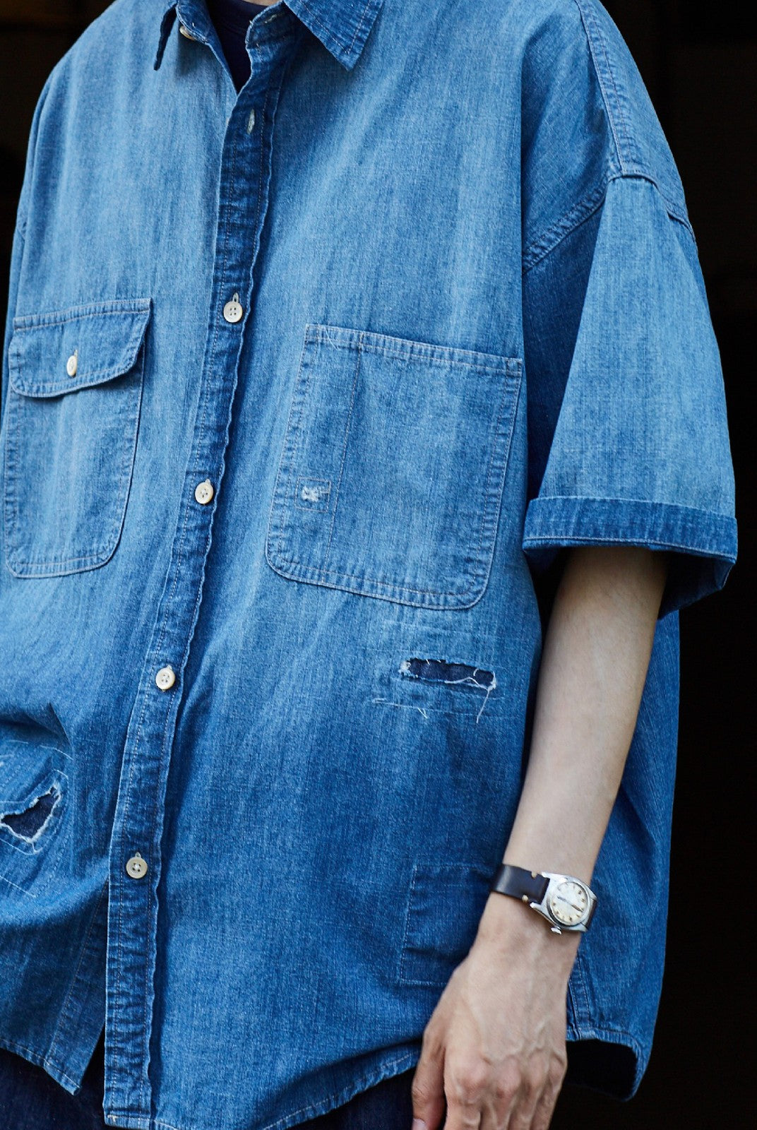 USAGE Distressed Short Sleeve Denim Shirt in Denim - On Male Model