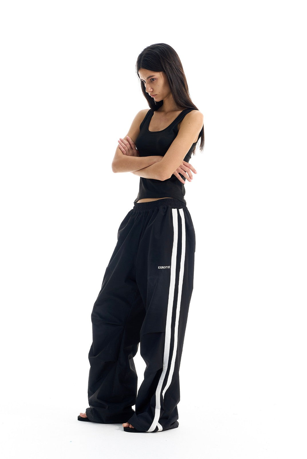 BLINDNOPLAN Striped Pleated Track Pants in Black - On Female Model