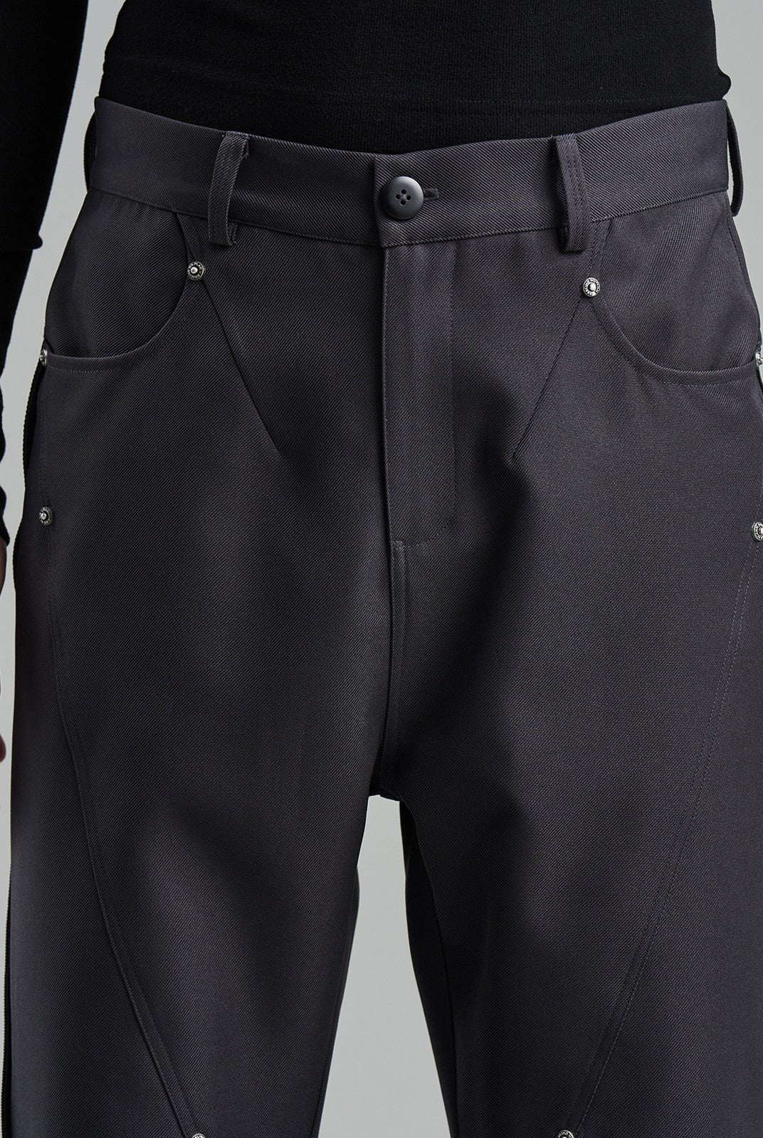BLINDNOPLAN Diagonal Paneled Trousers with Rivets in Gray - On Male Model
