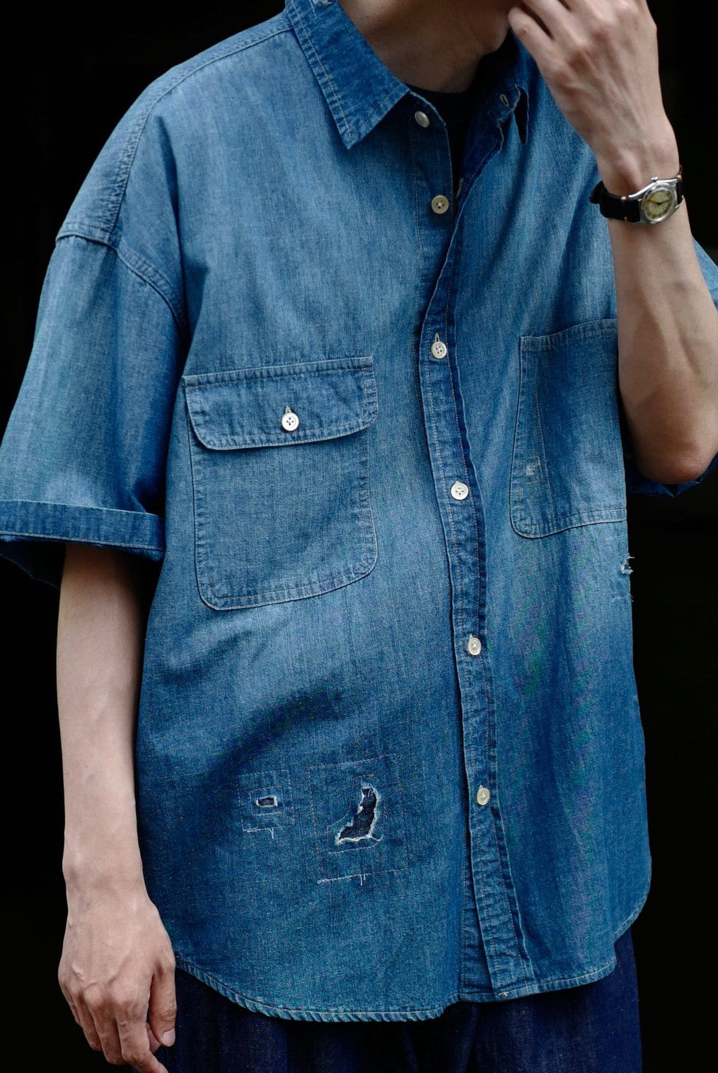 USAGE Distressed Short Sleeve Denim Shirt in Denim - On Male Model