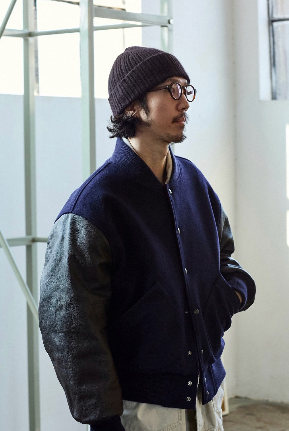 USAGE Reversible Velvet Leather Varsity Jacket in Navy Blue - On Male Model