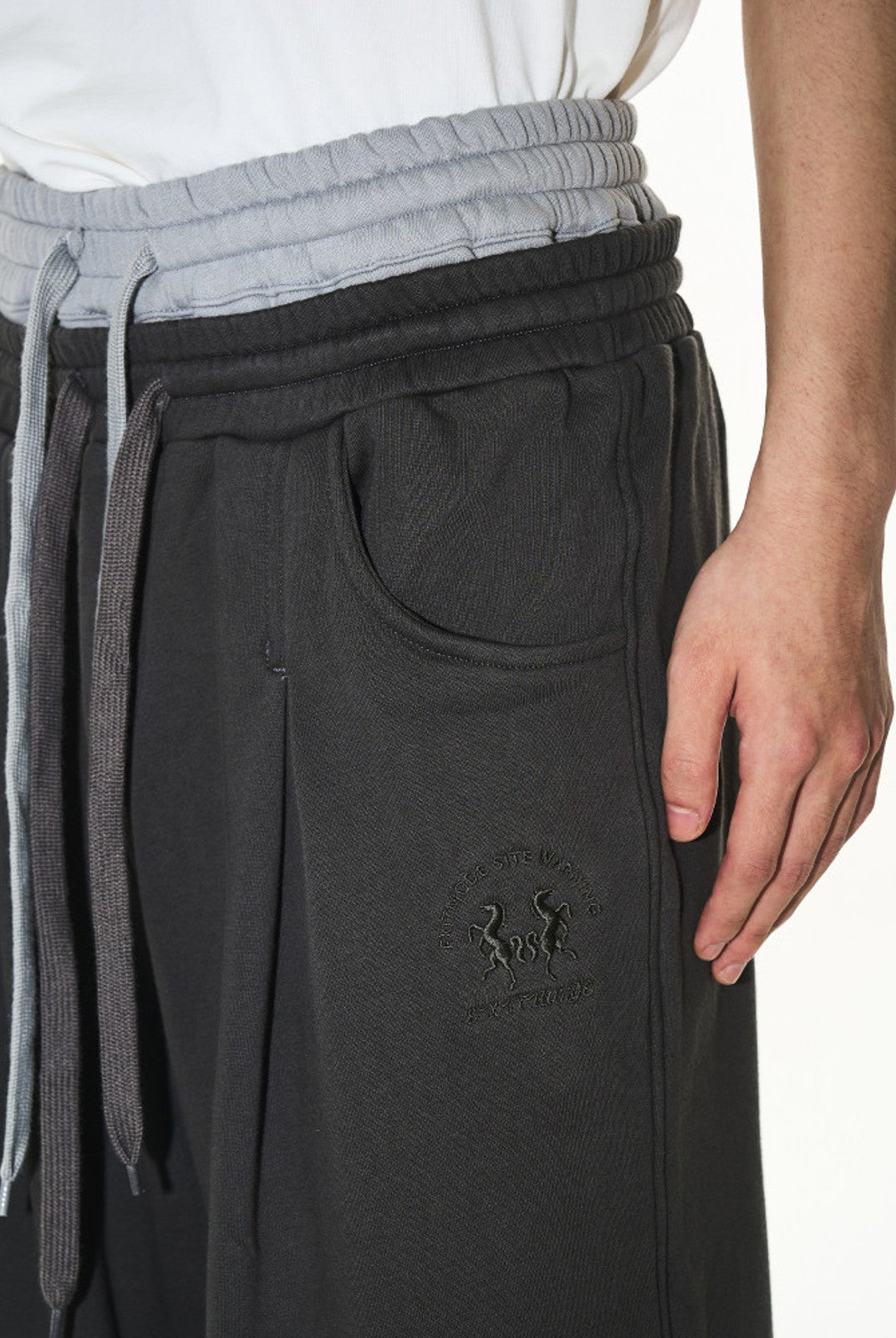 BLINDNOPLAN Double Waistband Pleated Sweatpants in Dark Gray - On Male Model