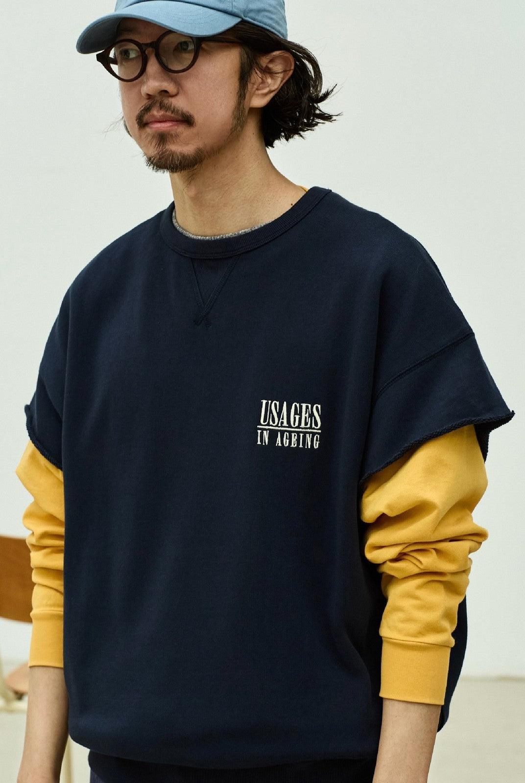 USAGE Raw Edge Cotton Short Sleeve Sweatshirt in Navy Blue - On Male Model