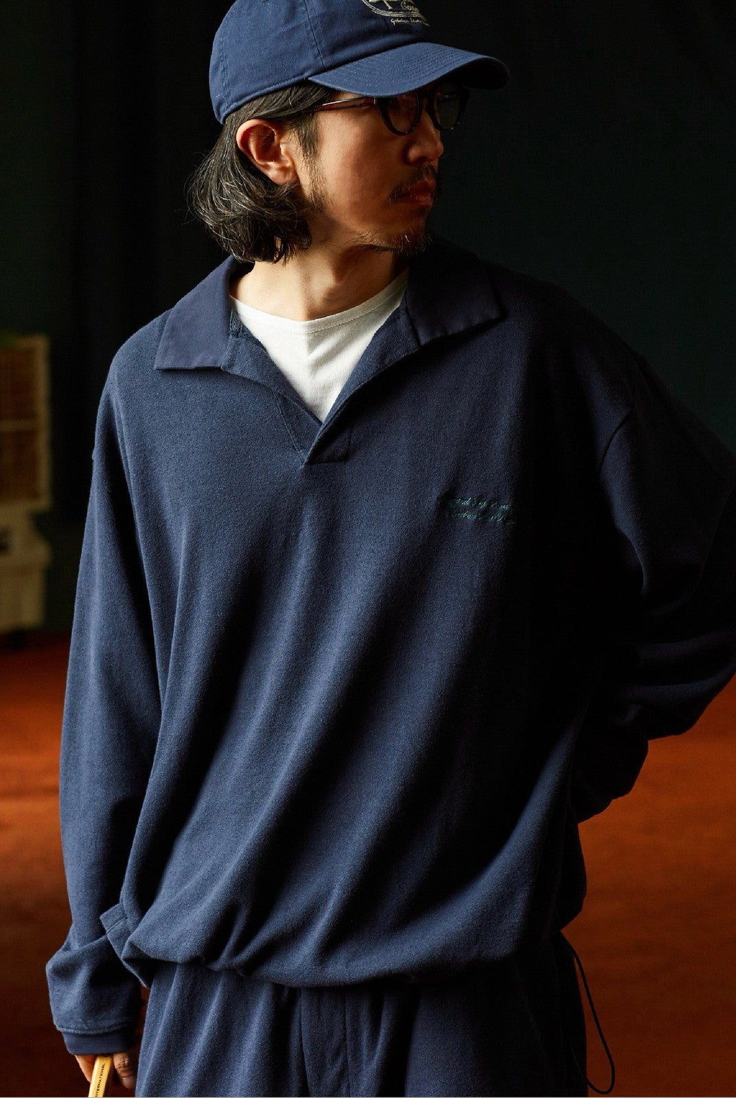 USAGE Oversized Textured Long Sleeve Polo in Navy Blue - On Male Model