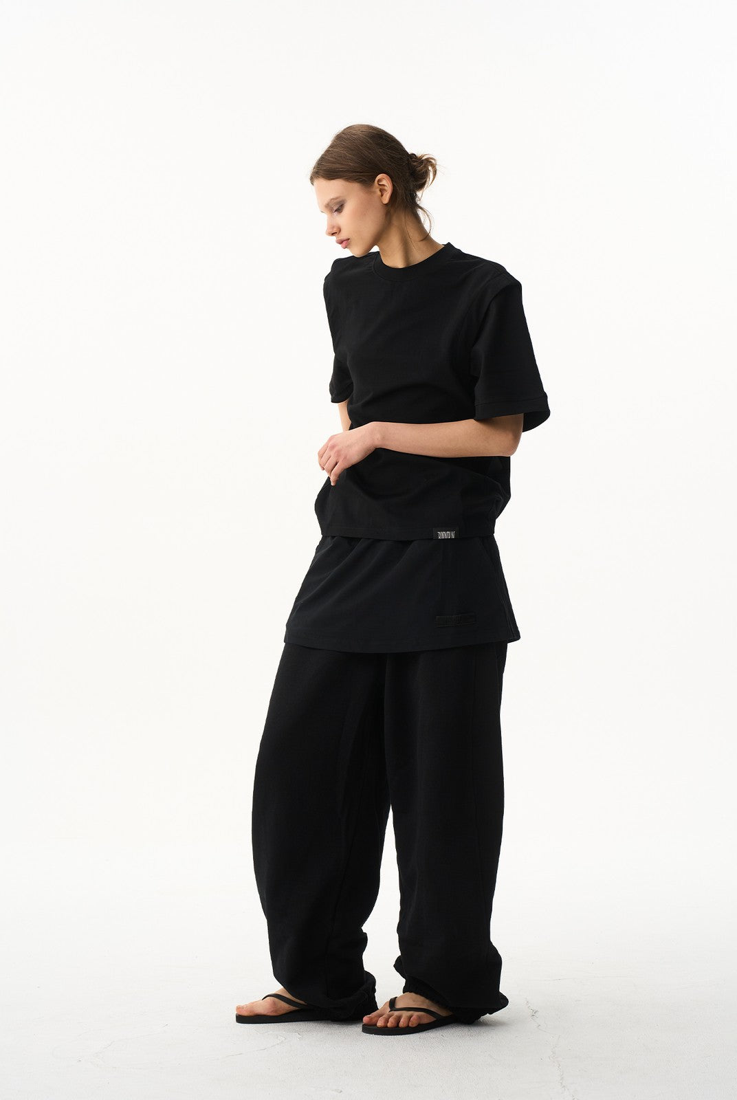 BLINDNOPLAN Layered Cotton Blend Sweatpants in Black - On Female Model