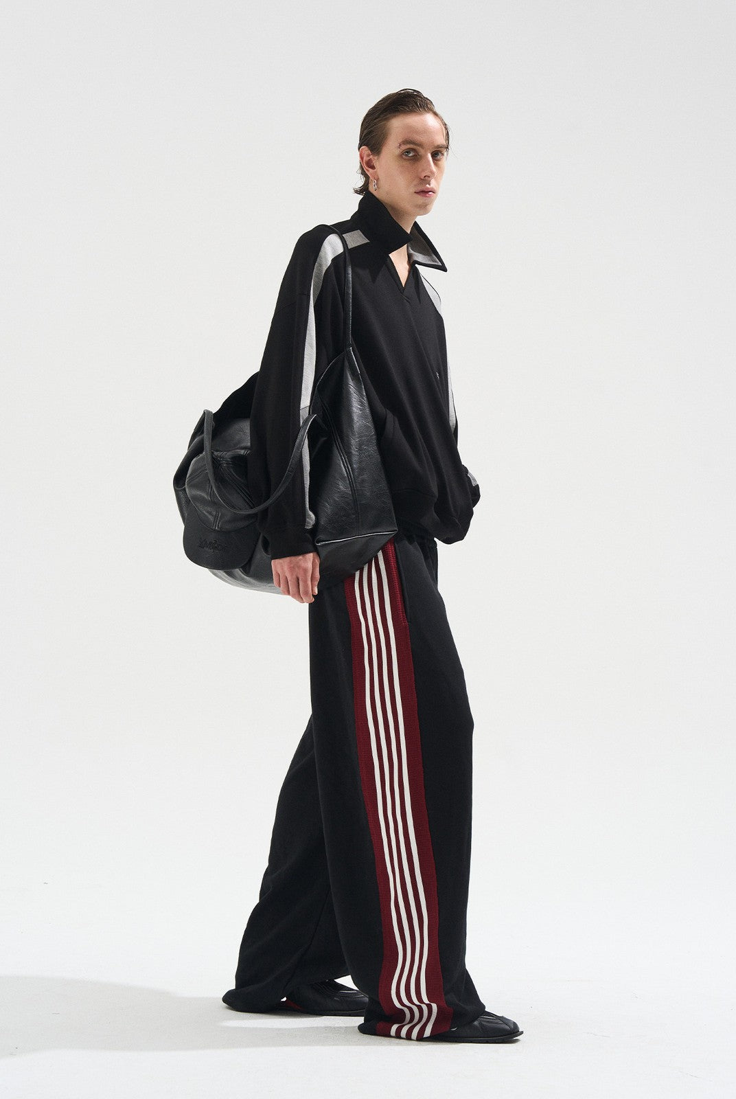 BLINDNOPLAN Raw Edge Contrast Paneled Sweatpants in Black - On Male Model