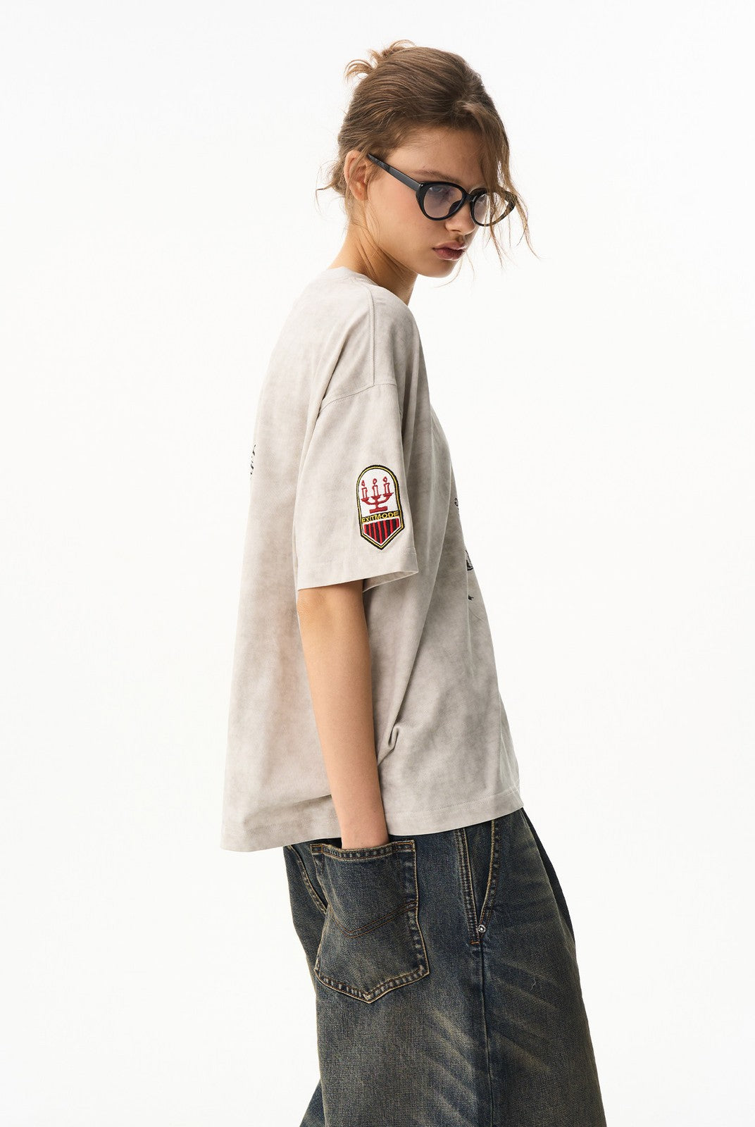 BLINDNOPLAN Wax Print Unicorn Graphic T Shirt in Beige - On Female Model