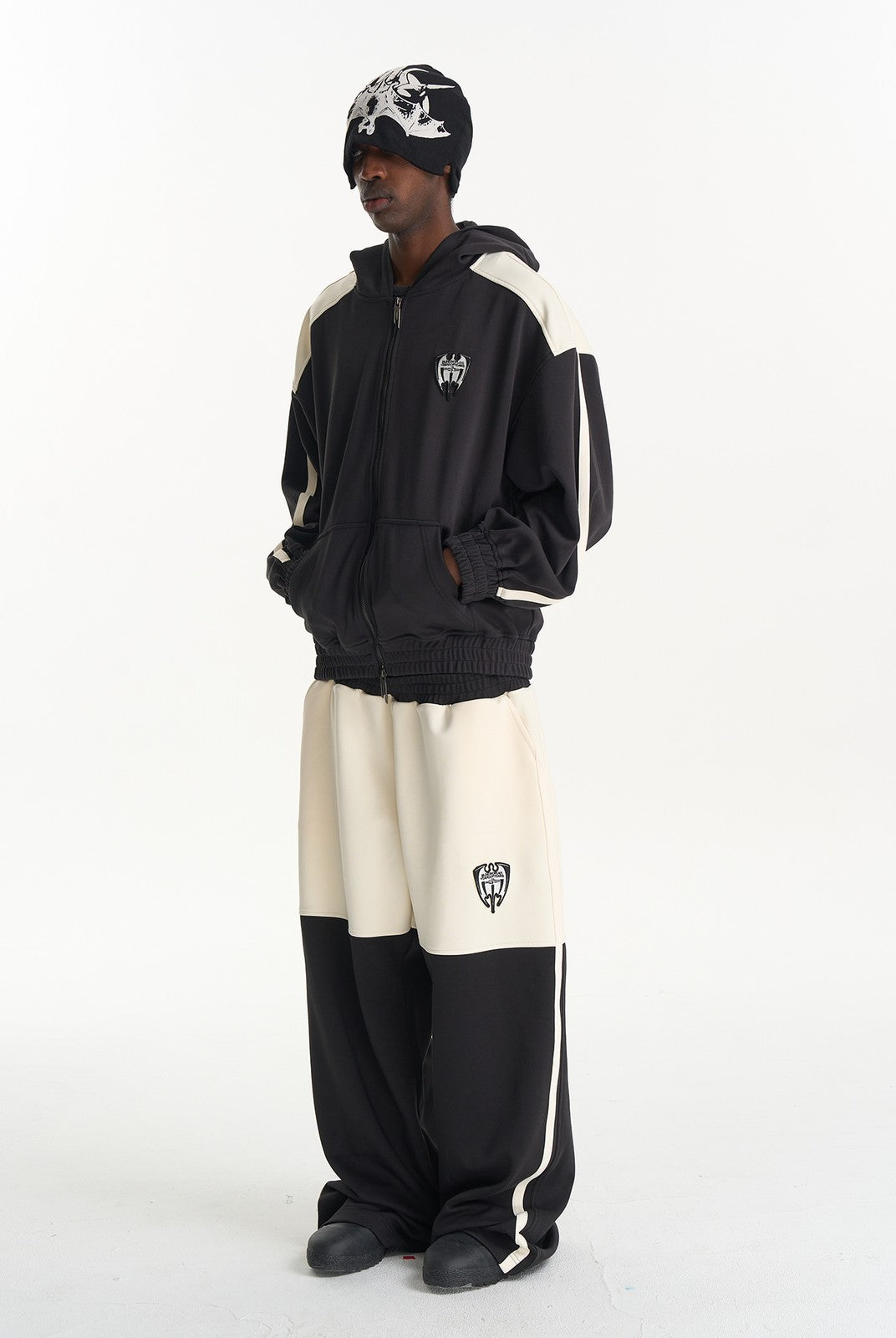 BLINDNOPLAN Hooded Colorblock Track Jacket in Black - On Male Model