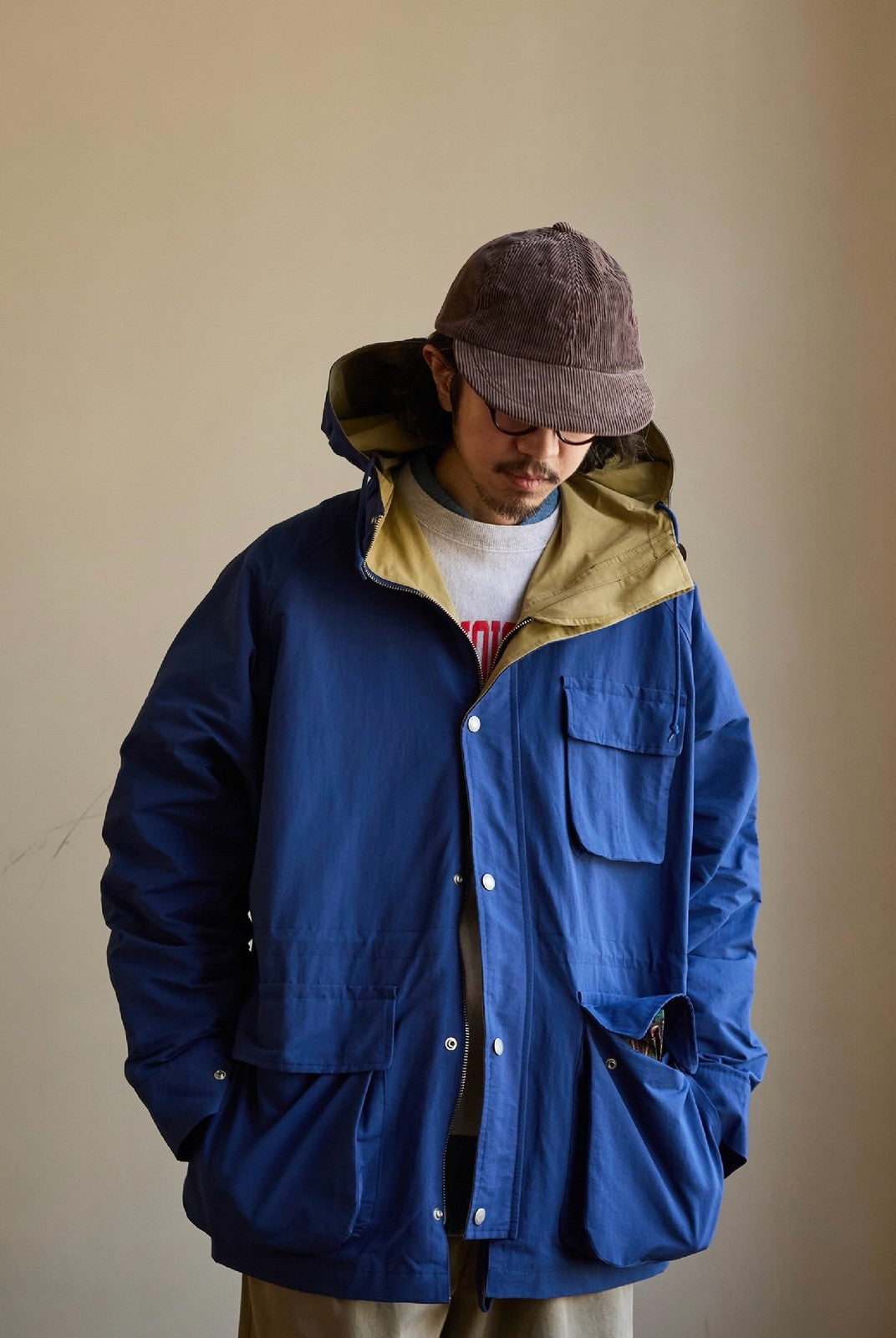 USAGE Cotton Nylon Hooded Mountain Parka in Blue - On Male Model