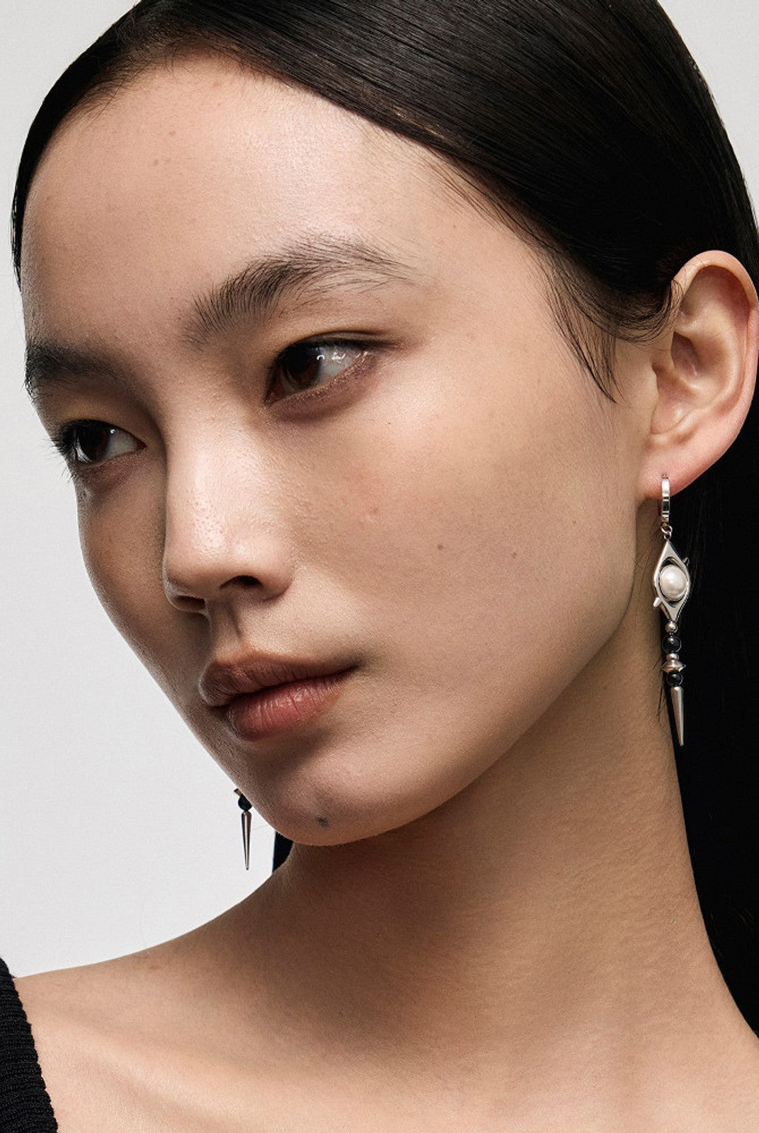 BLACKHEAD Pearl Eye Spike Drop Earrings in Silver - On Female Model