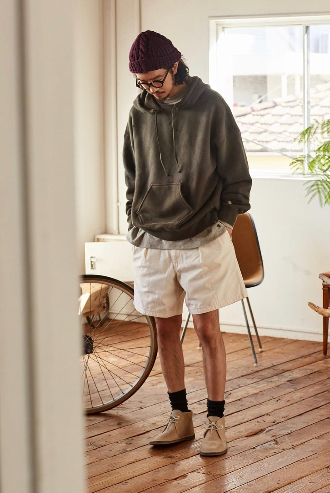 USAGE Faded Vintage Wash Hoodie in Olive - On Male Model