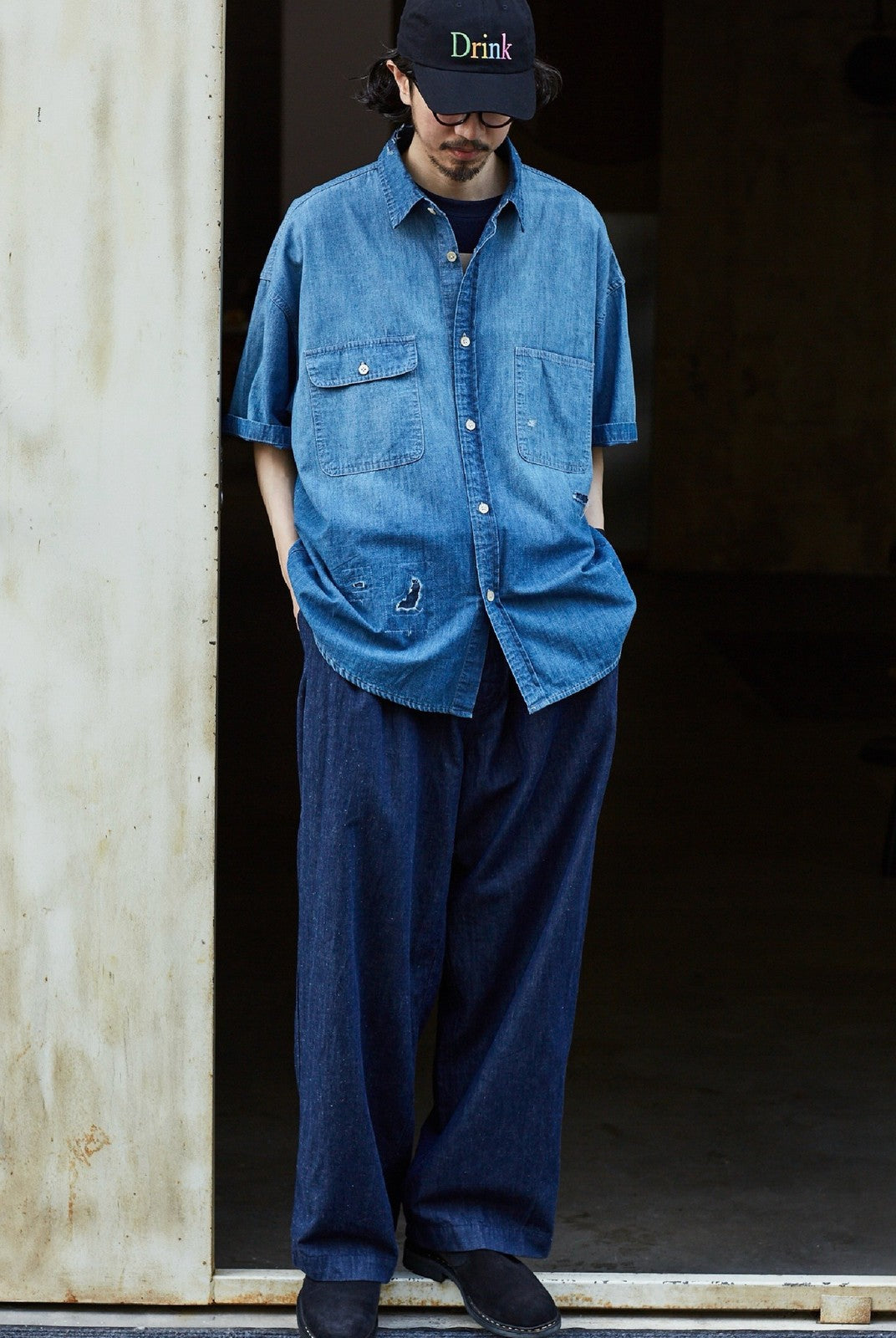USAGE Distressed Short Sleeve Denim Shirt in Denim - On Male Model