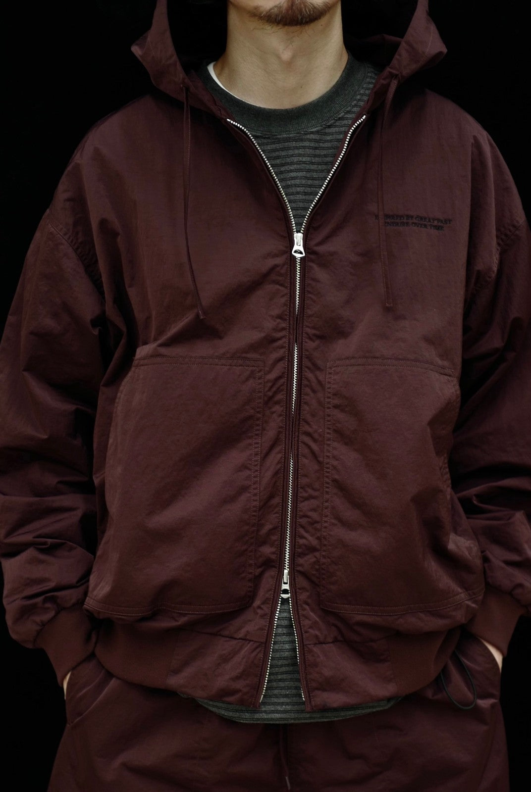 USAGE Crinkle Nylon Hooded Track Jacket in Brown - On Male Model